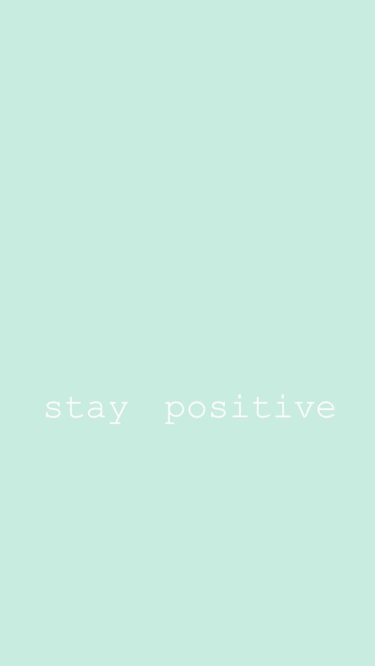 Print 桌布 壁紙 — 簡約薄荷綠色背景，中央有白色文字寫著 stay positive。