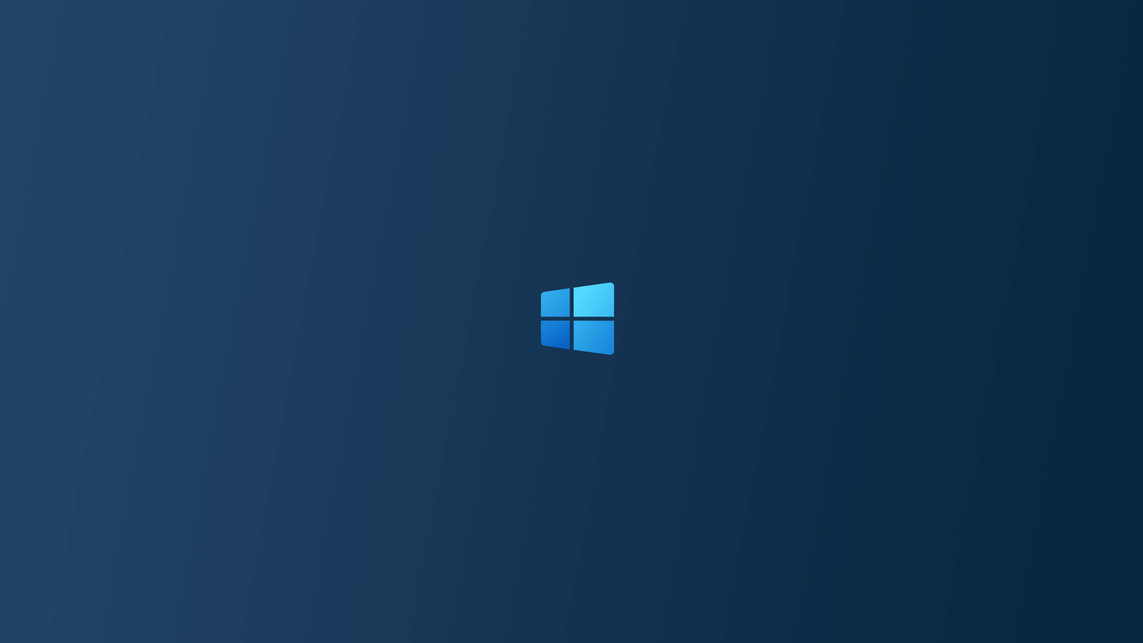 標誌 桌布 壁紙 — 簡約藍色漸變背景，Windows 標誌居中置於深藍色背景上。