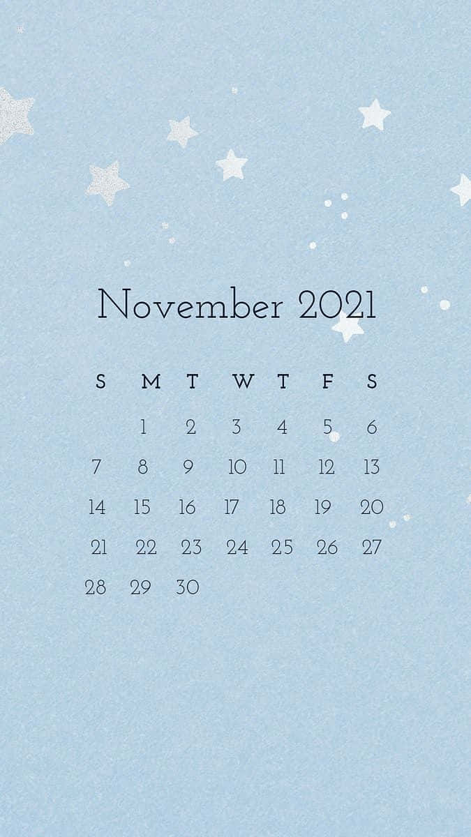 Stars 桌布 壁紙 — 簡約風格的2021年11月月曆，白色星星點綴在柔和的藍色紋理背景上。