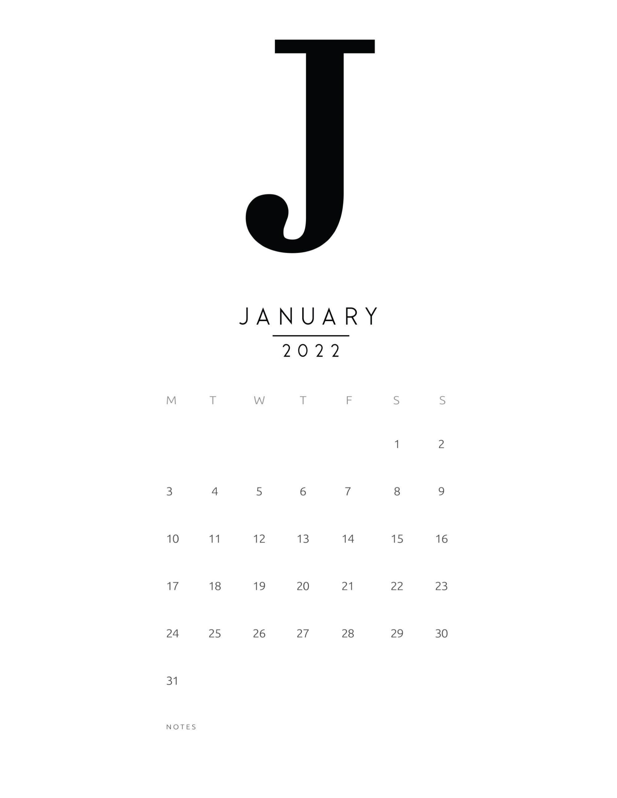 一月 桌布 壁紙 — 簡約黑白2022年1月日曆，帶有大型粗體J和白色背景上的整潔網格佈局。