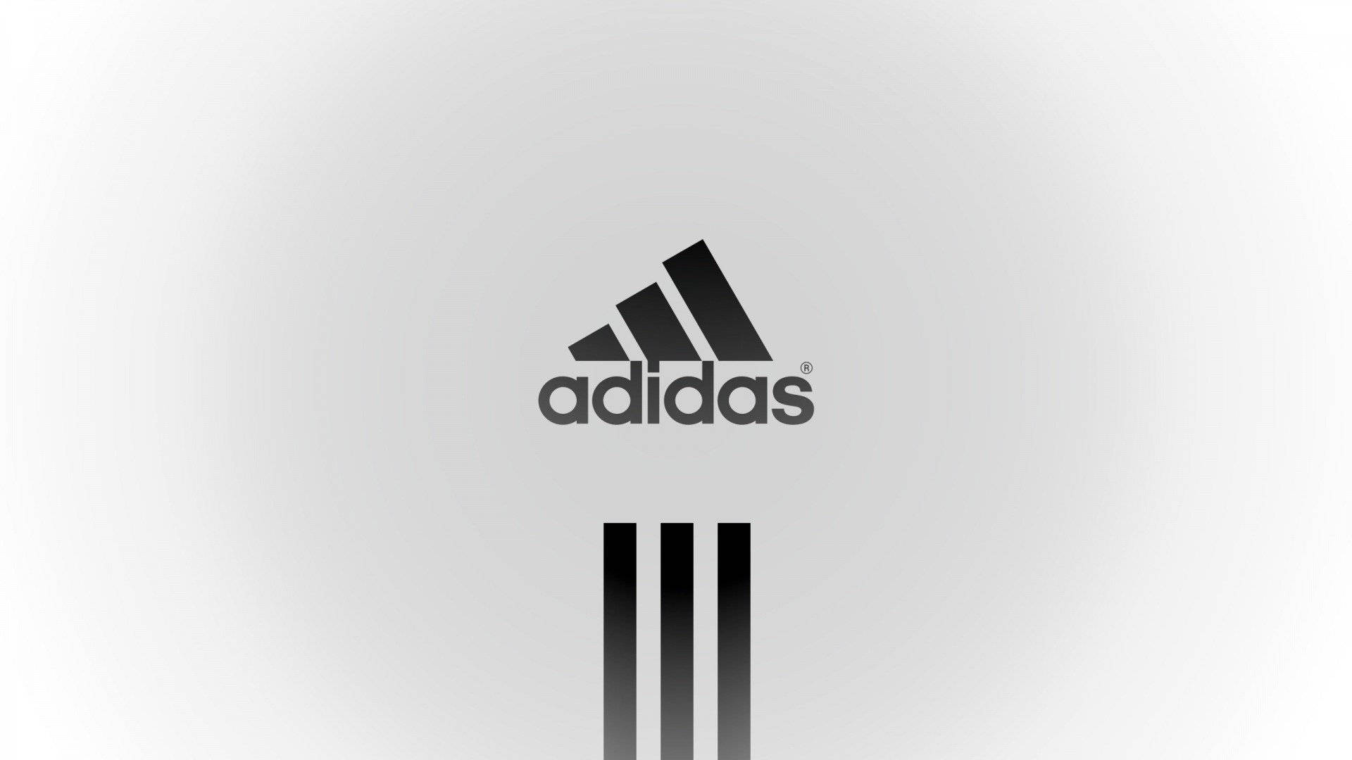 愛迪達 桌布 壁紙 — 簡約黑色adidas標誌居中於柔和灰色漸變背景上，下方有三條紋。