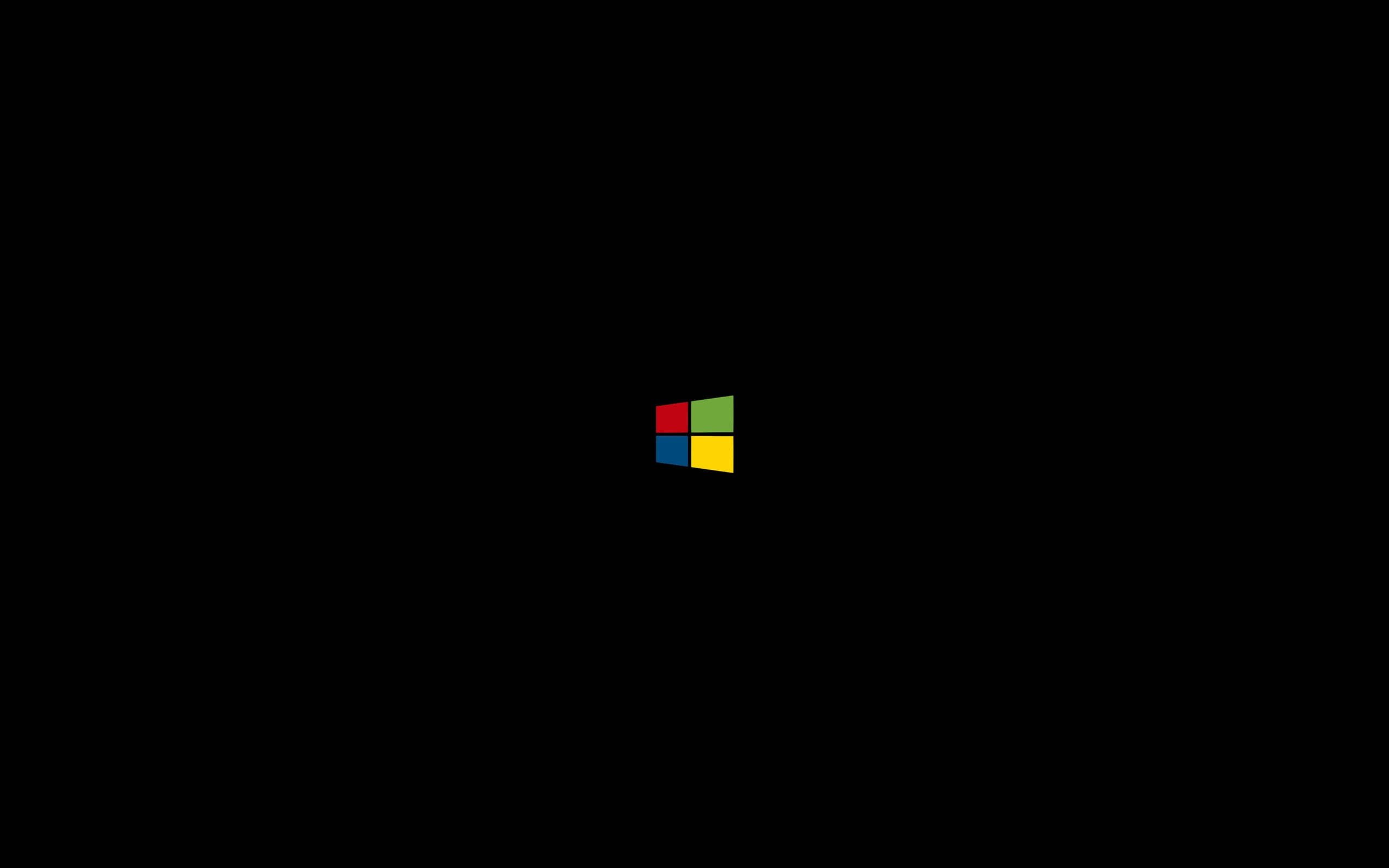 背景 桌布 壁紙 — 簡約黑色背景，中央放置標誌性的四色 Microsoft Windows 標誌。