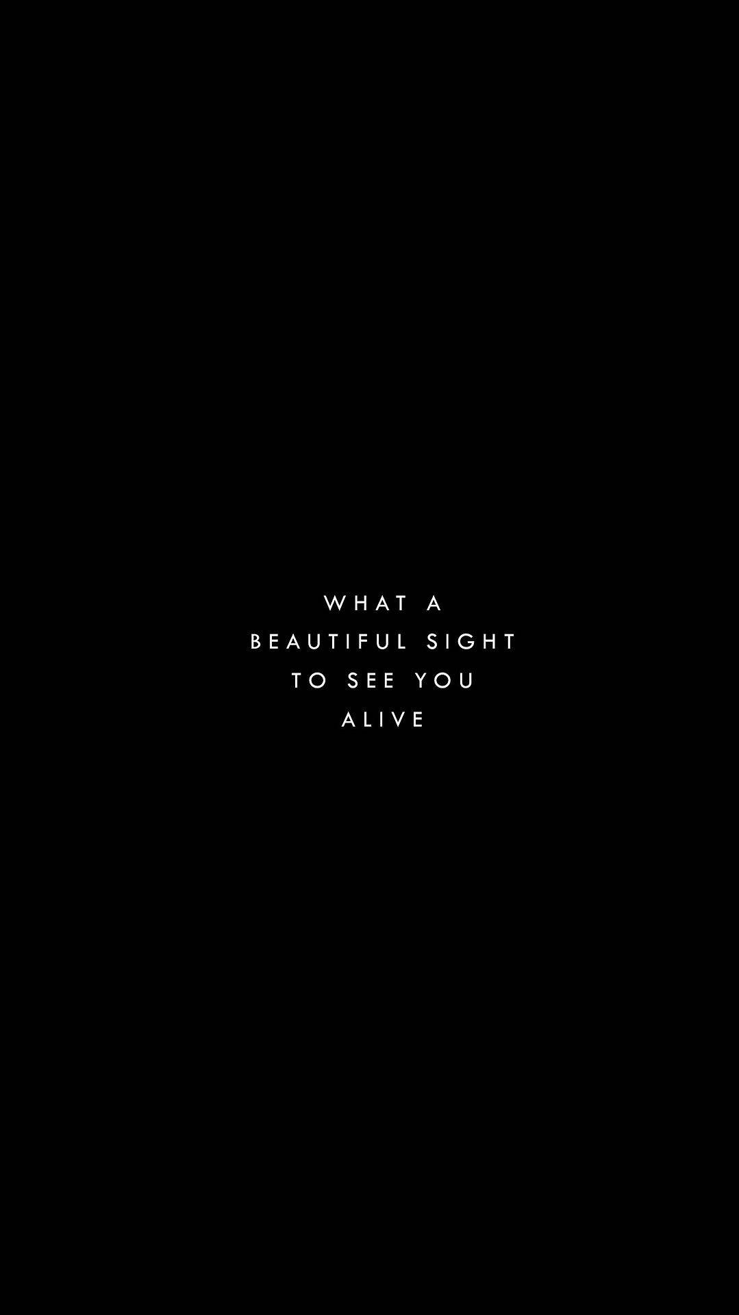 Quote 桌布 壁紙 — 簡約黑色背景，中央白色文字顯示 what a beautiful sight to see you alive。
