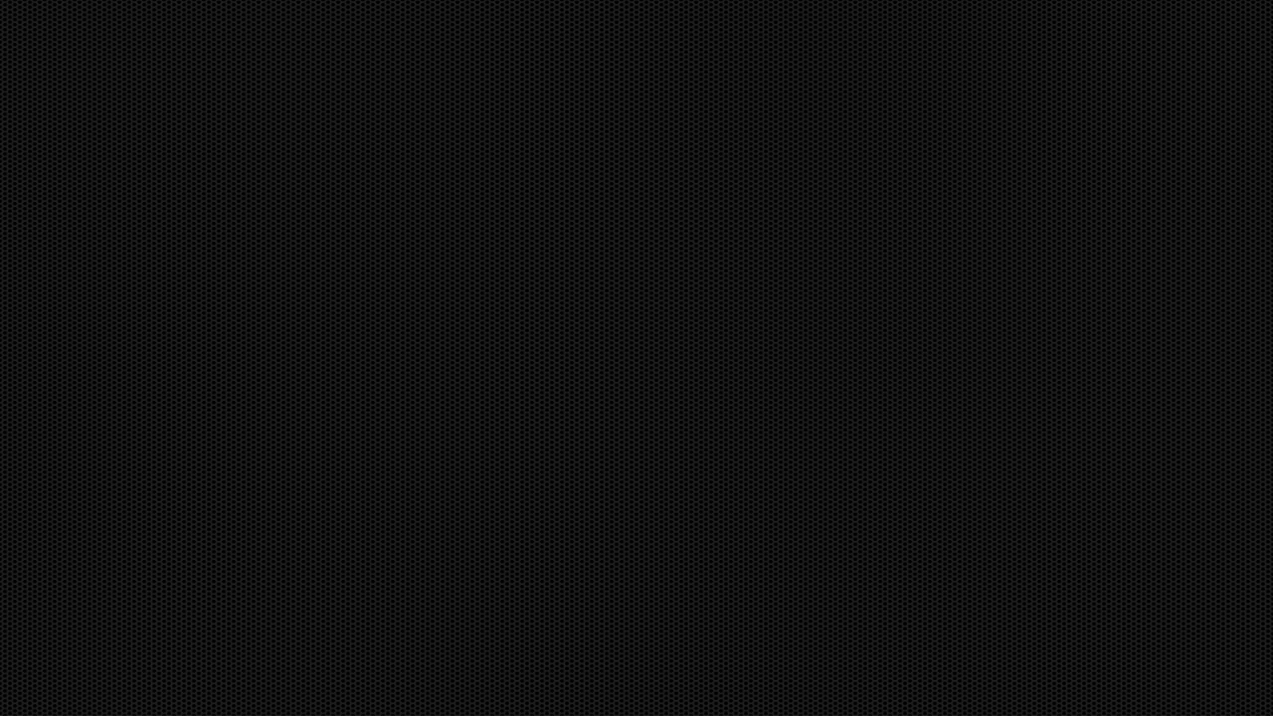 2560x1440 Black 桌布 壁紙 — 簡約黑色背景，帶有微妙的重複圓點圖案，營造紋理和深度。