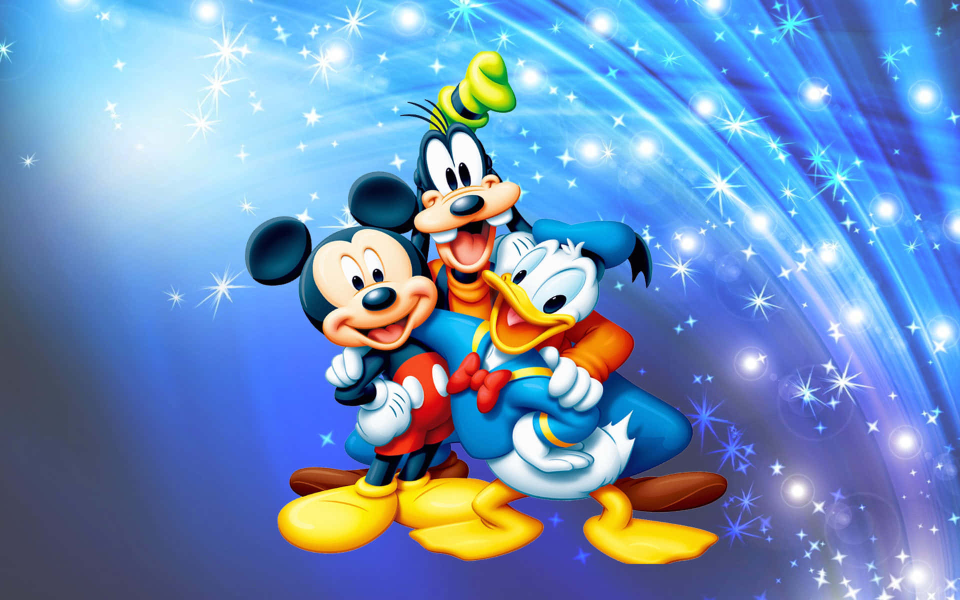 Mickey Mouse Desktop 桌布 壁紙 — 米奇、高飛和唐老鴨在閃爍的藍色宇宙背景和燦爛的星爆中快樂地擠在一起。