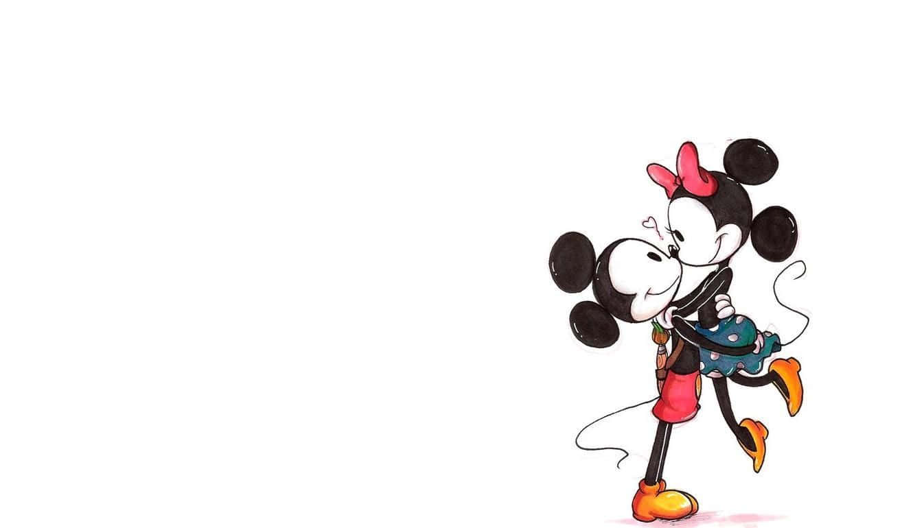 Mickey And Minnie Mouse 桌布 壁紙 — 米奇和米妮老鼠在純白色背景前以經典卡通風格甜蜜接吻。
