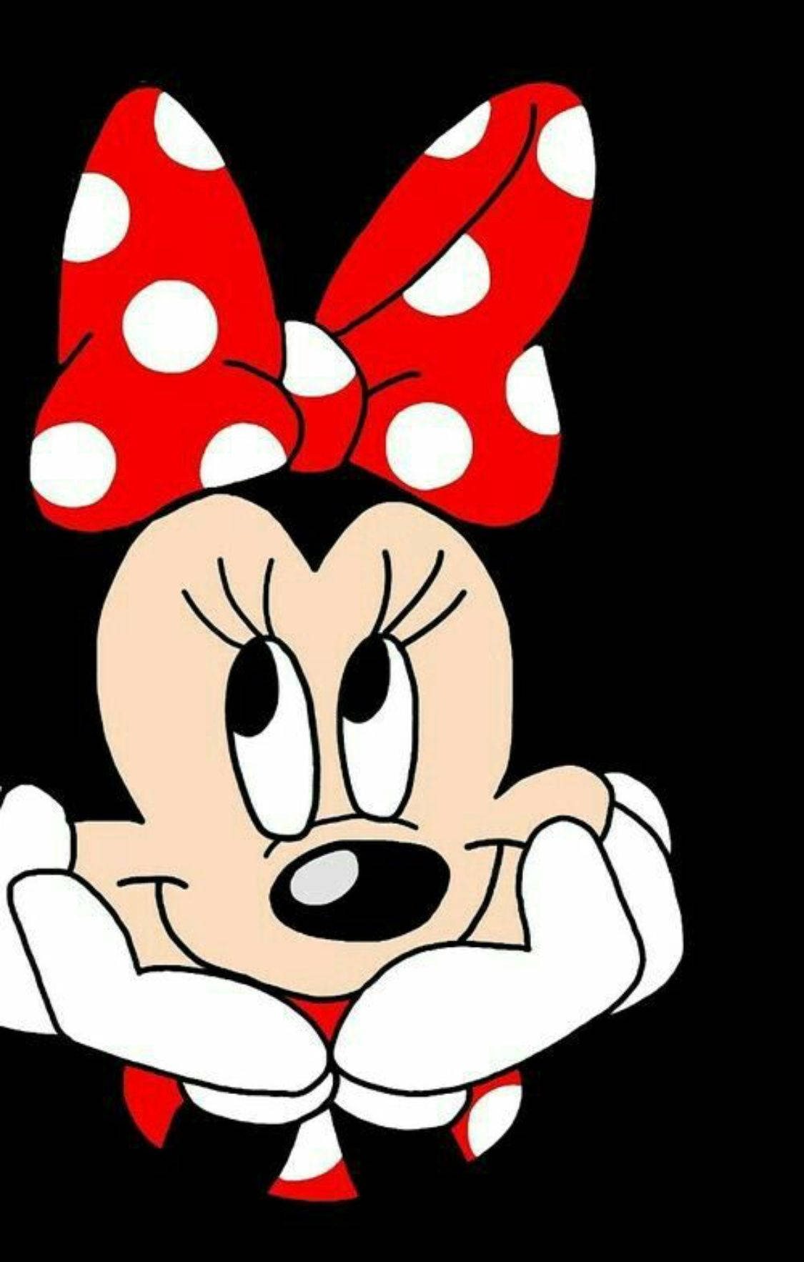 minnie 桌布 壁紙 — 米妮老鼠戴著標誌性的紅色圓點蝴蝶結，雙手托腮，背景為純黑色。