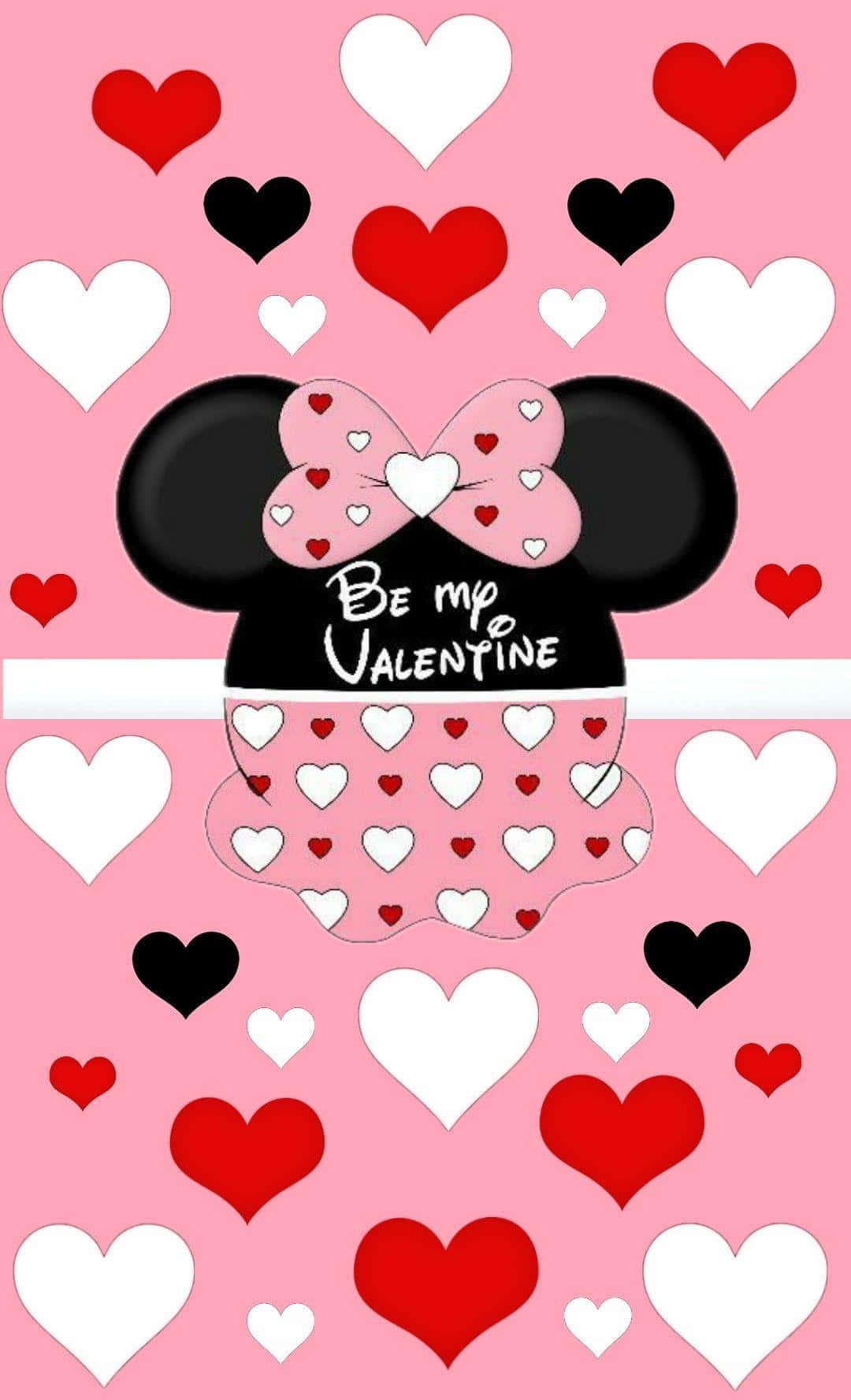 Disney Valentine 桌布 壁紙 — 米妮老鼠身穿心形圖案連衣裙，戴著蝴蝶結，在充滿紅色、白色和黑色心形的粉紅色背景前，問你是否願意做她的情人節對象。