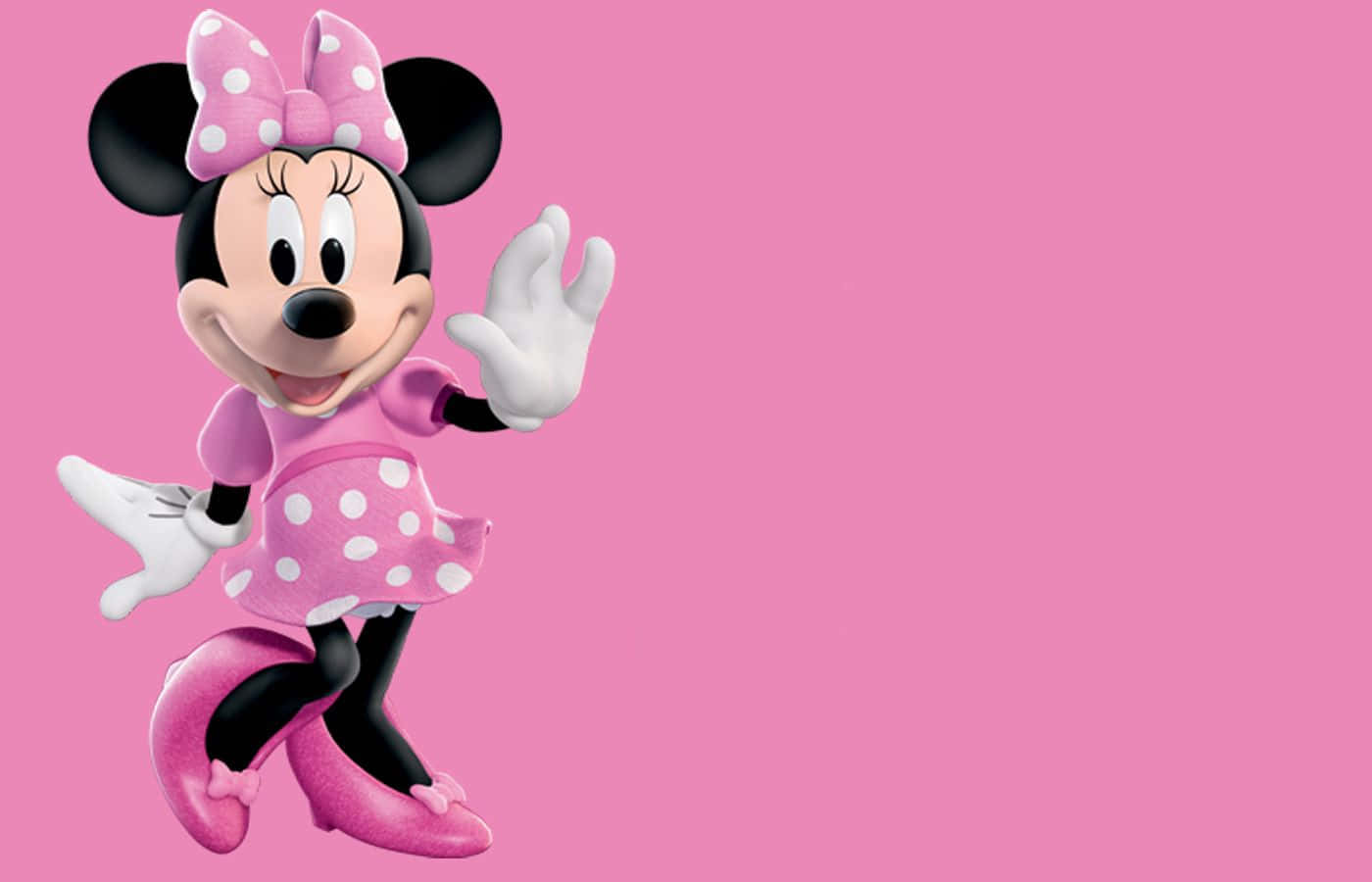 Minnie Mouse Pink 桌布 壁紙 — 米妮老鼠身穿粉紅色圓點連衣裙，在純粉紅色背景上愉快地揮手。