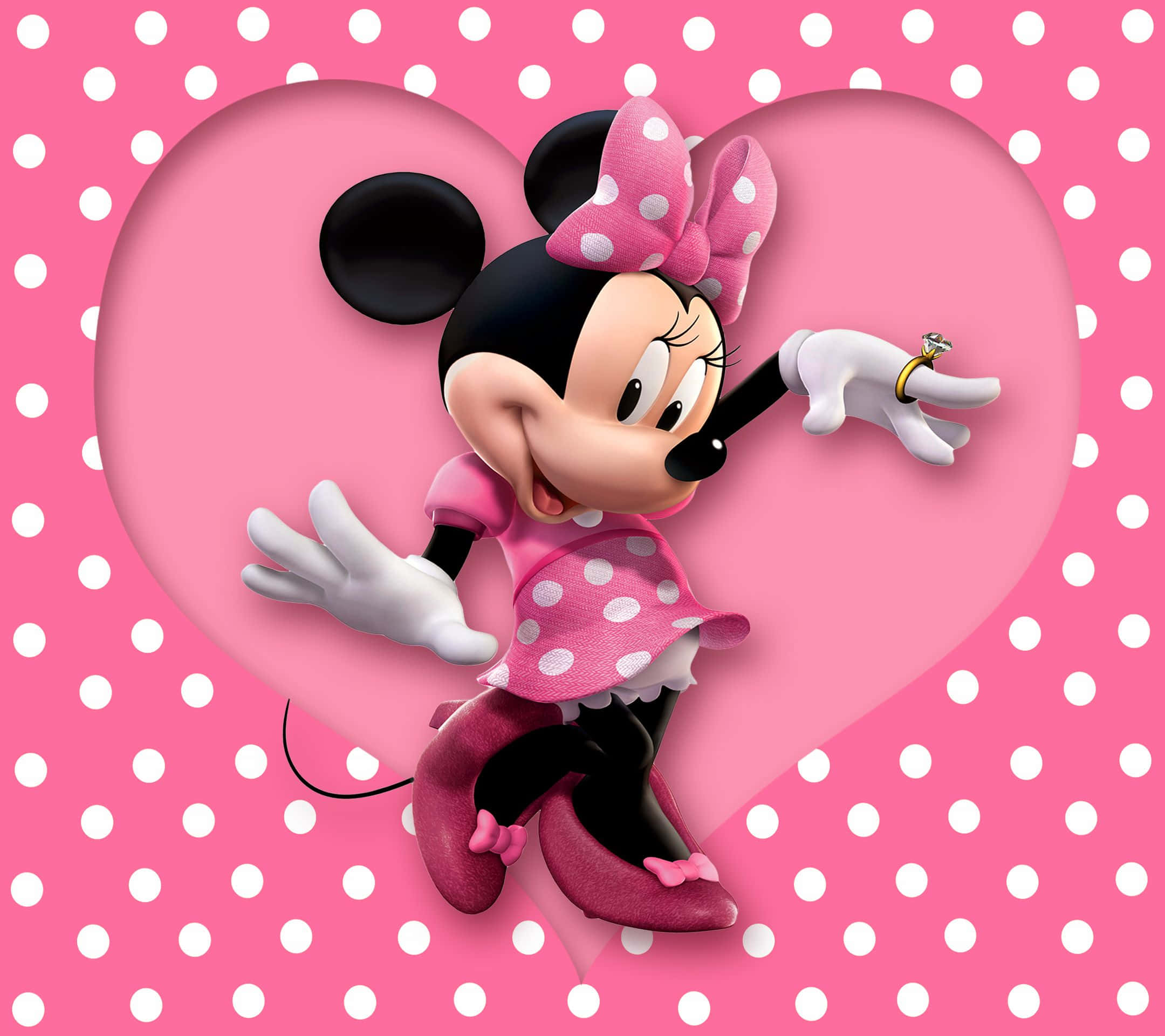 Minnie Mouse Pink 桌布 壁紙 — 米妮老鼠身穿粉紅色圓點連衣裙，在粉紅色圓點背景的心形鏤空內快樂地拿著一枚戒指。
