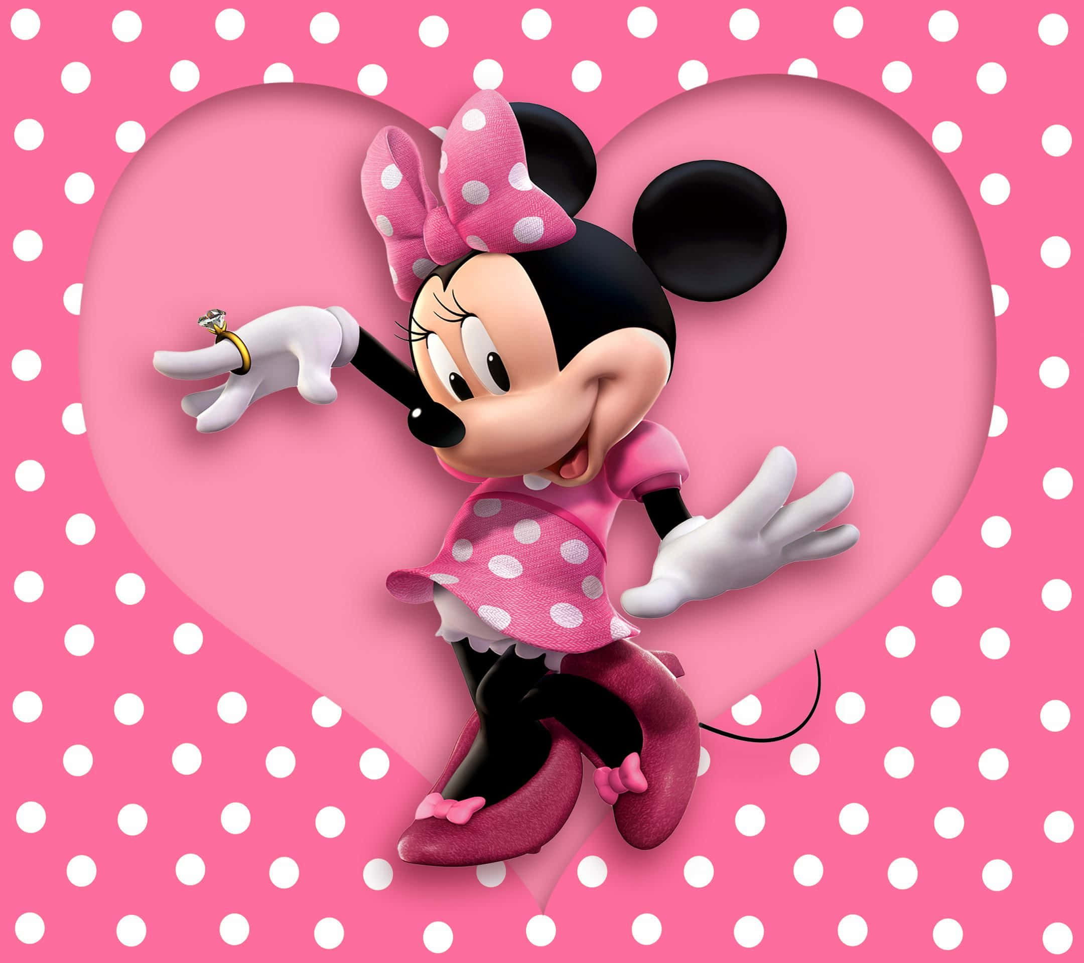 Minnie Mouse Pink 桌布 壁紙 — 米妮老鼠身穿粉紅色圓點連衣裙，在粉紅色圓點背景的心形鏤空內快樂地拿著一枚戒指。