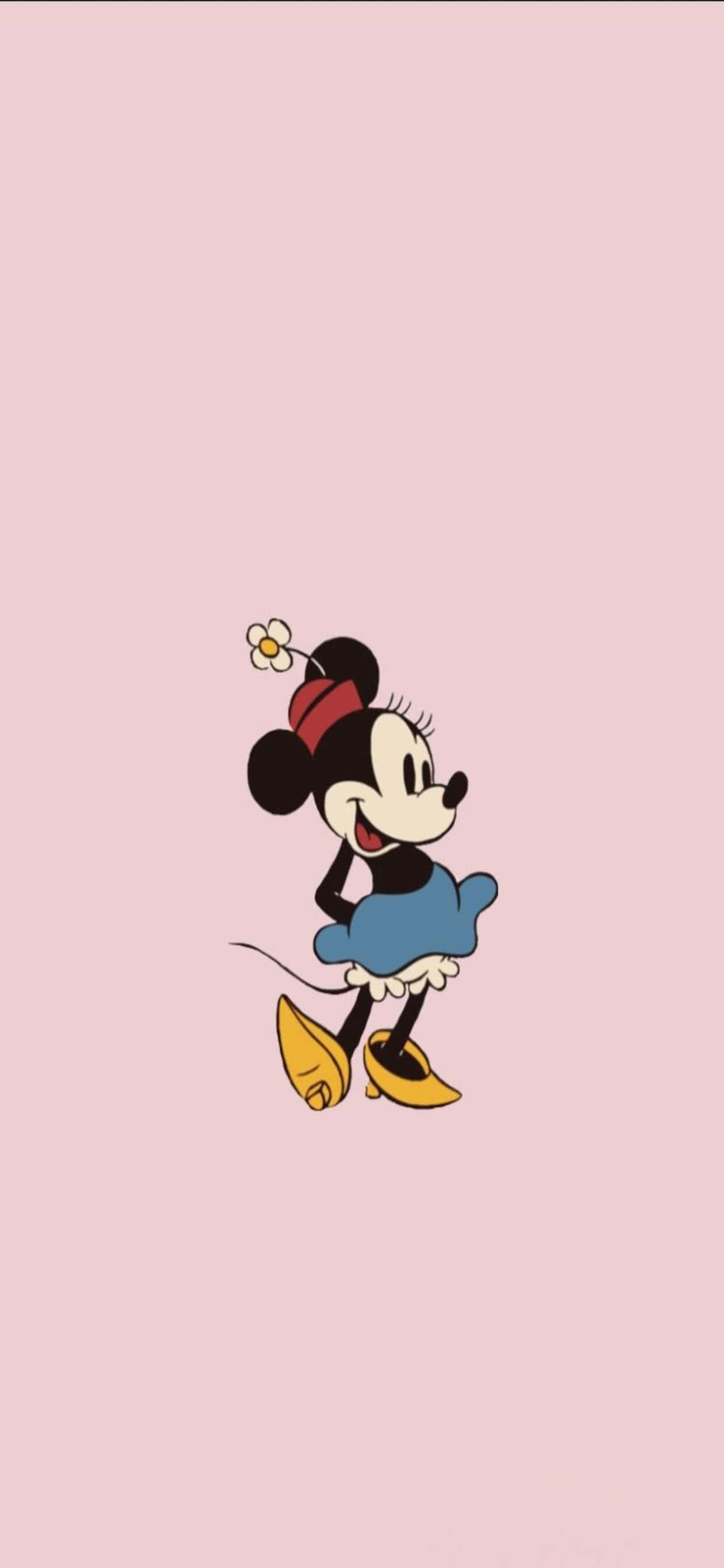 iPhone Xs Max Disney 桌布 壁紙 — 米妮老鼠身穿藍色連衣裙和紅色蝴蝶結，在柔和的粉紅色背景上開心地微笑。
