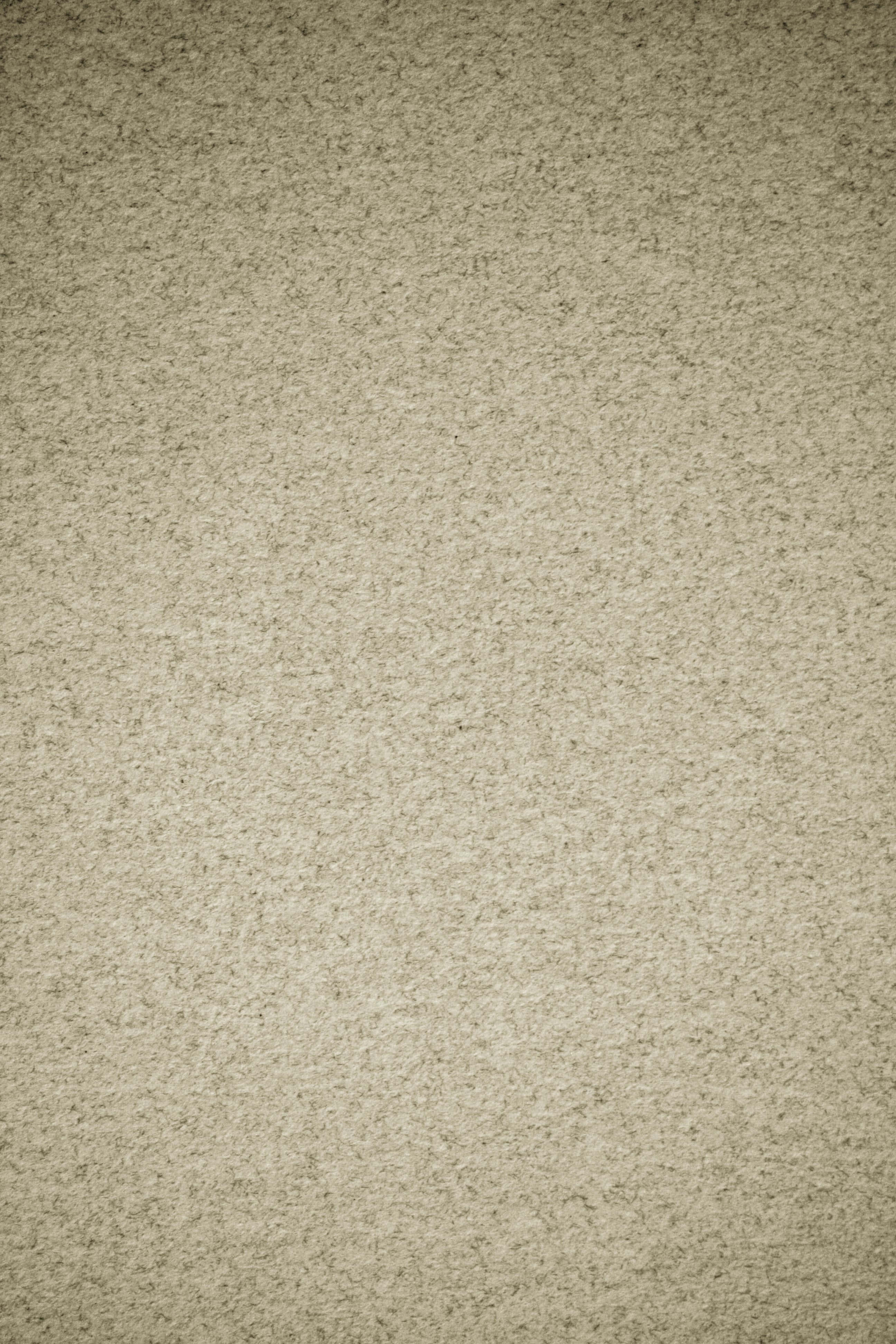 Paper Texture 桌布 壁紙 — 米色紋理地毯的特寫，帶有微妙的斑點和柔軟的纖維，在均勻的燈光下。