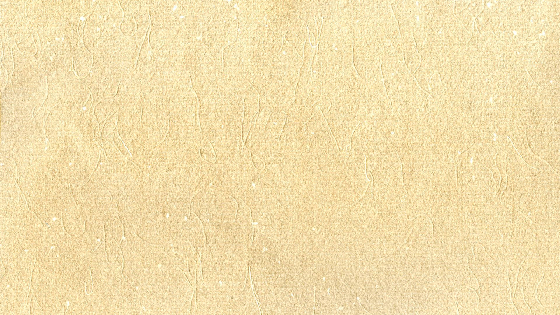 Beige Minimalist 桌布 壁紙 — 米色紋理壁紙的特寫，帶有微妙的漩渦圖案和斑點亮點。