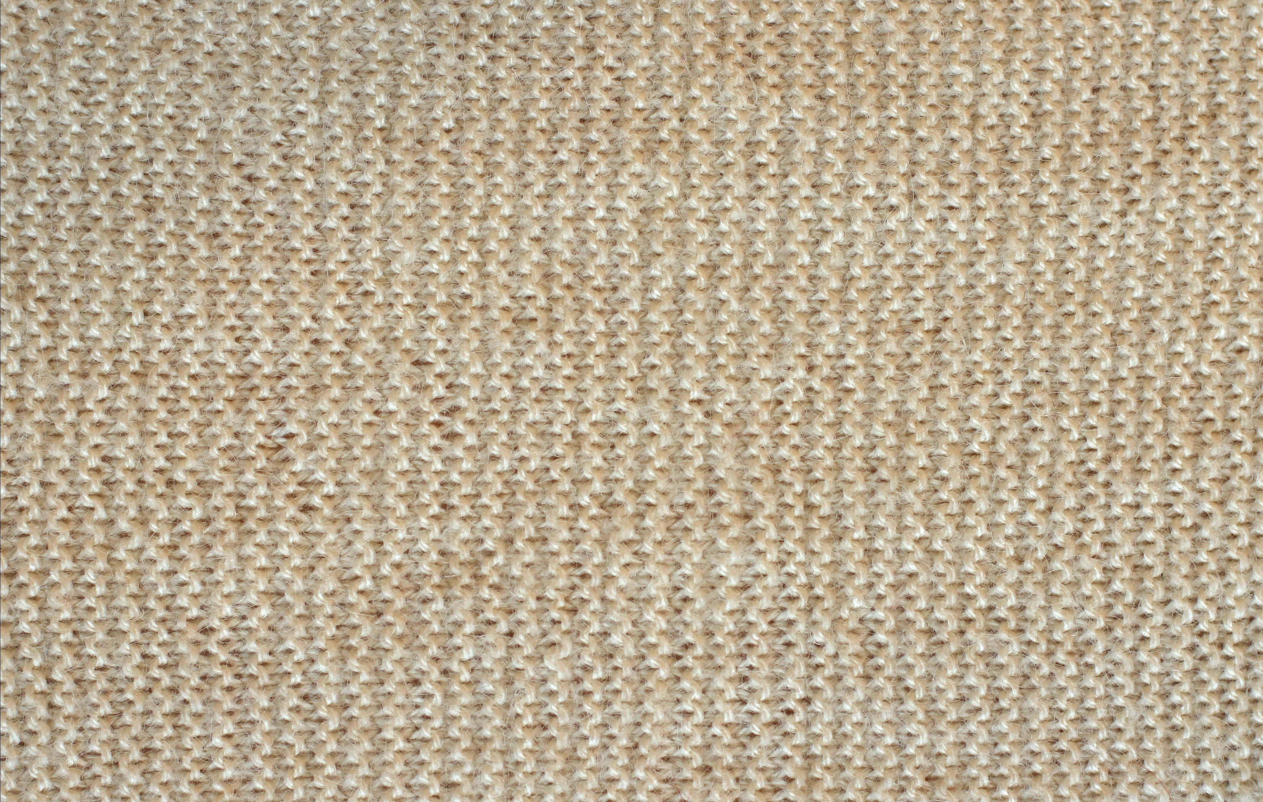 Textured 桌布 壁紙 — 米色編織布料的特寫，具有一致的紋理圖案和柔和自然色調。