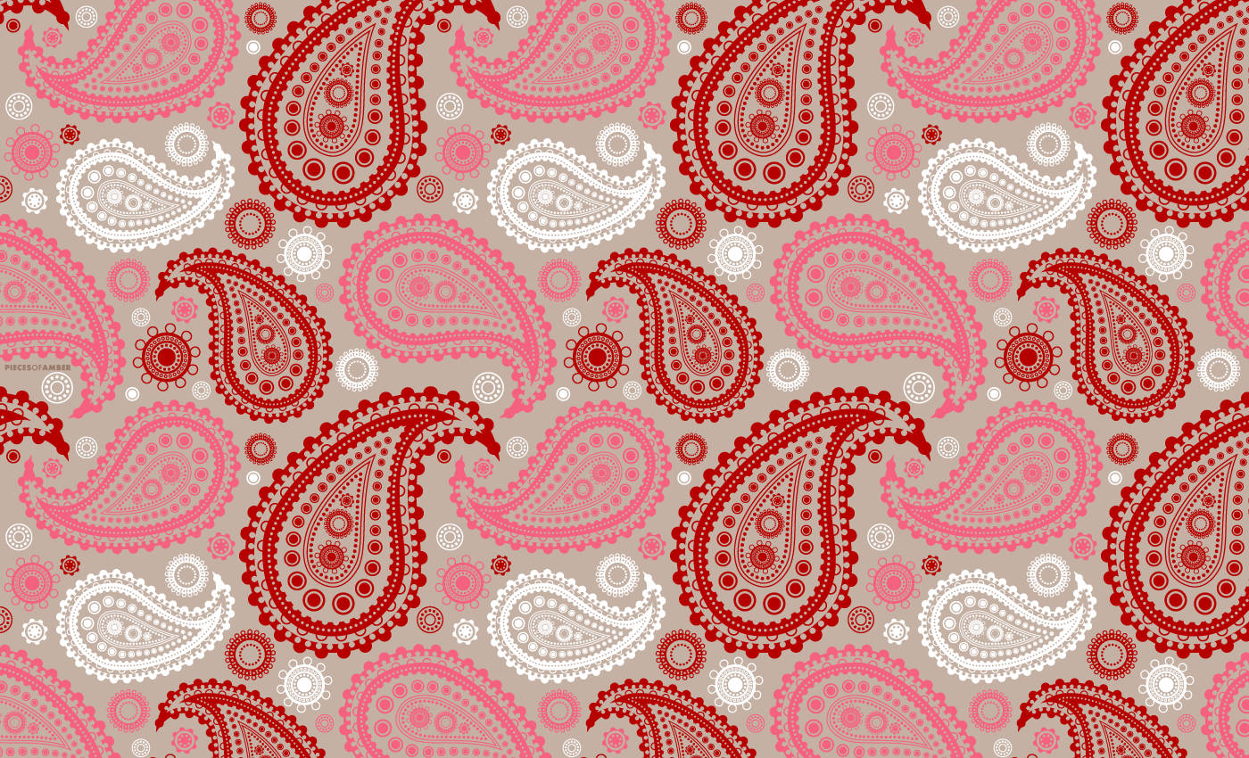 Paisley 桌布 壁紙 — 米色背景上重複的紅色、粉紅色和白色佩斯利圖案，帶有複雜的圓點細節。