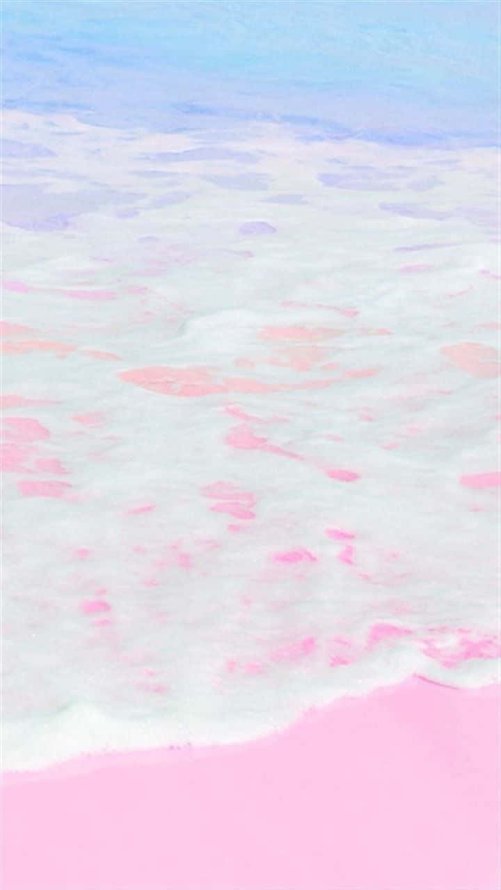 pastel 桌布 壁紙 — 粉彩粉紅和藍色的海浪輕輕拍打柔軟的粉紅色海岸，呈現夢幻水彩風格。