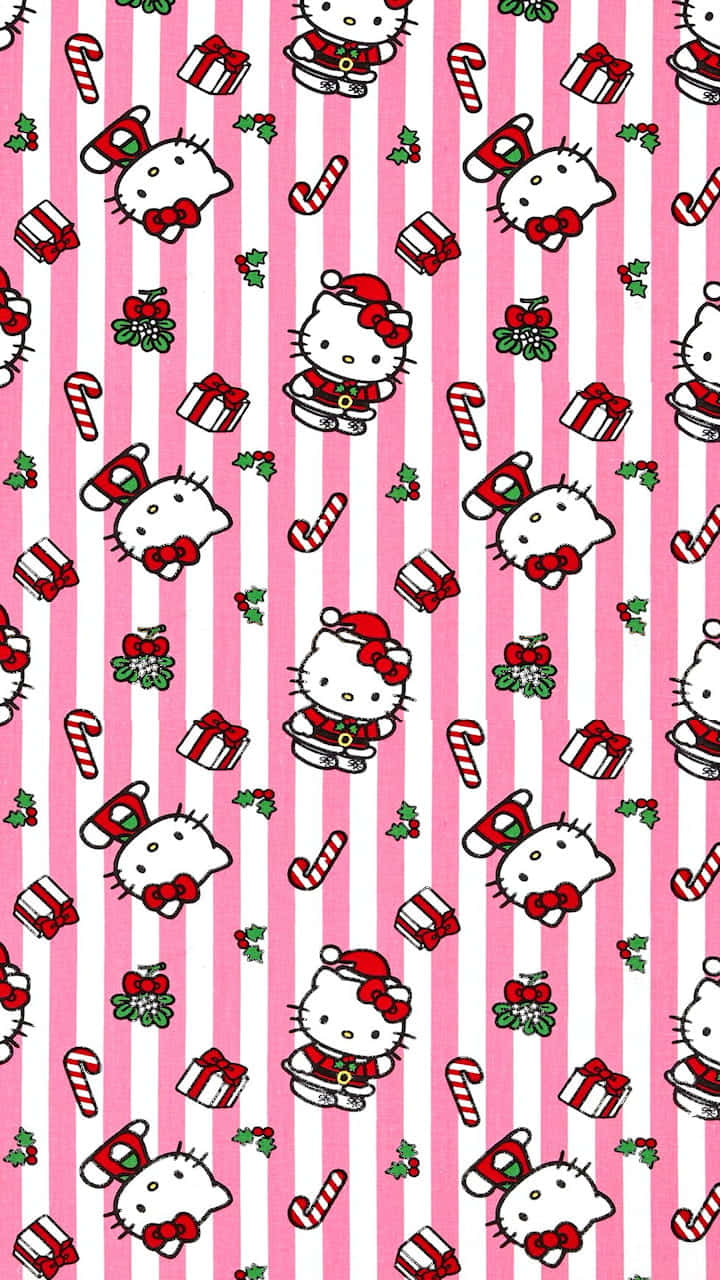 Hello Kitty Christmas 桌布 壁紙 — 粉紅和白色條紋壁紙，重複出現穿著聖誕服裝、手持拐杖糖和禮物的Hello Kitty。
