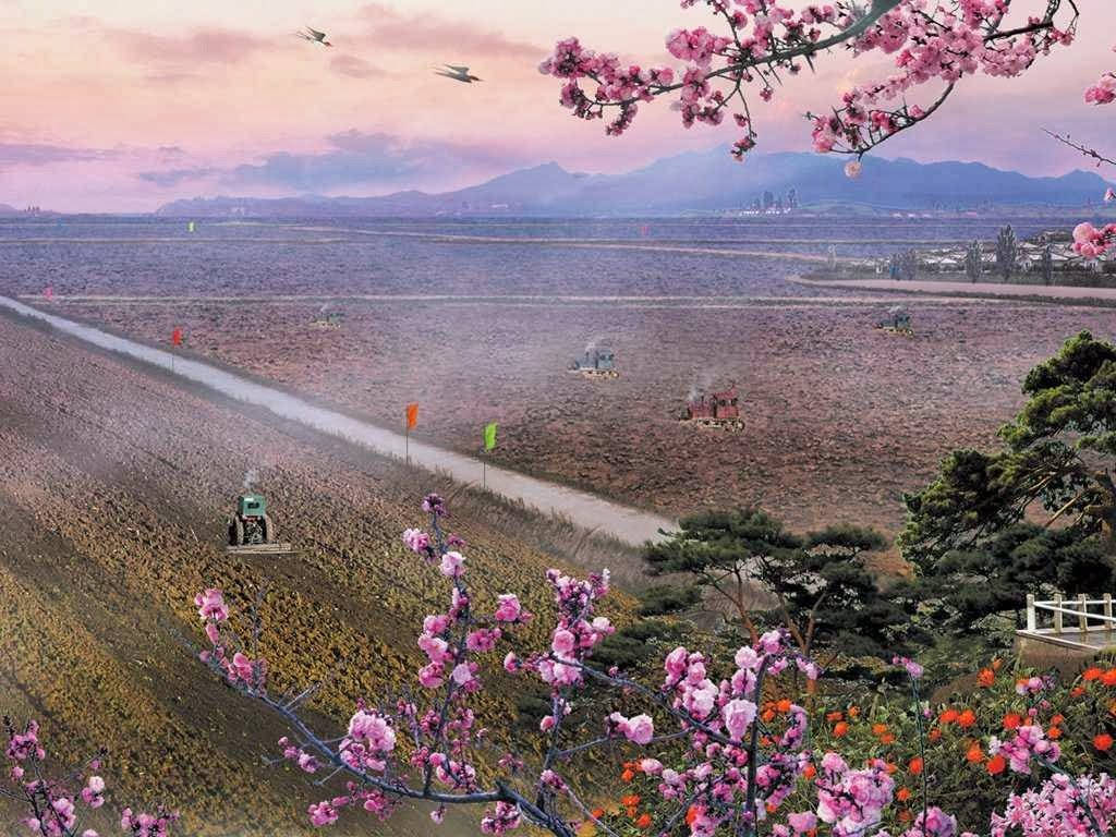 field of dreams 桌布 壁紙 — 粉紅櫻花框住一片廣闊的紫色田野，遠處有山巒，天空是柔和的粉紅日落。