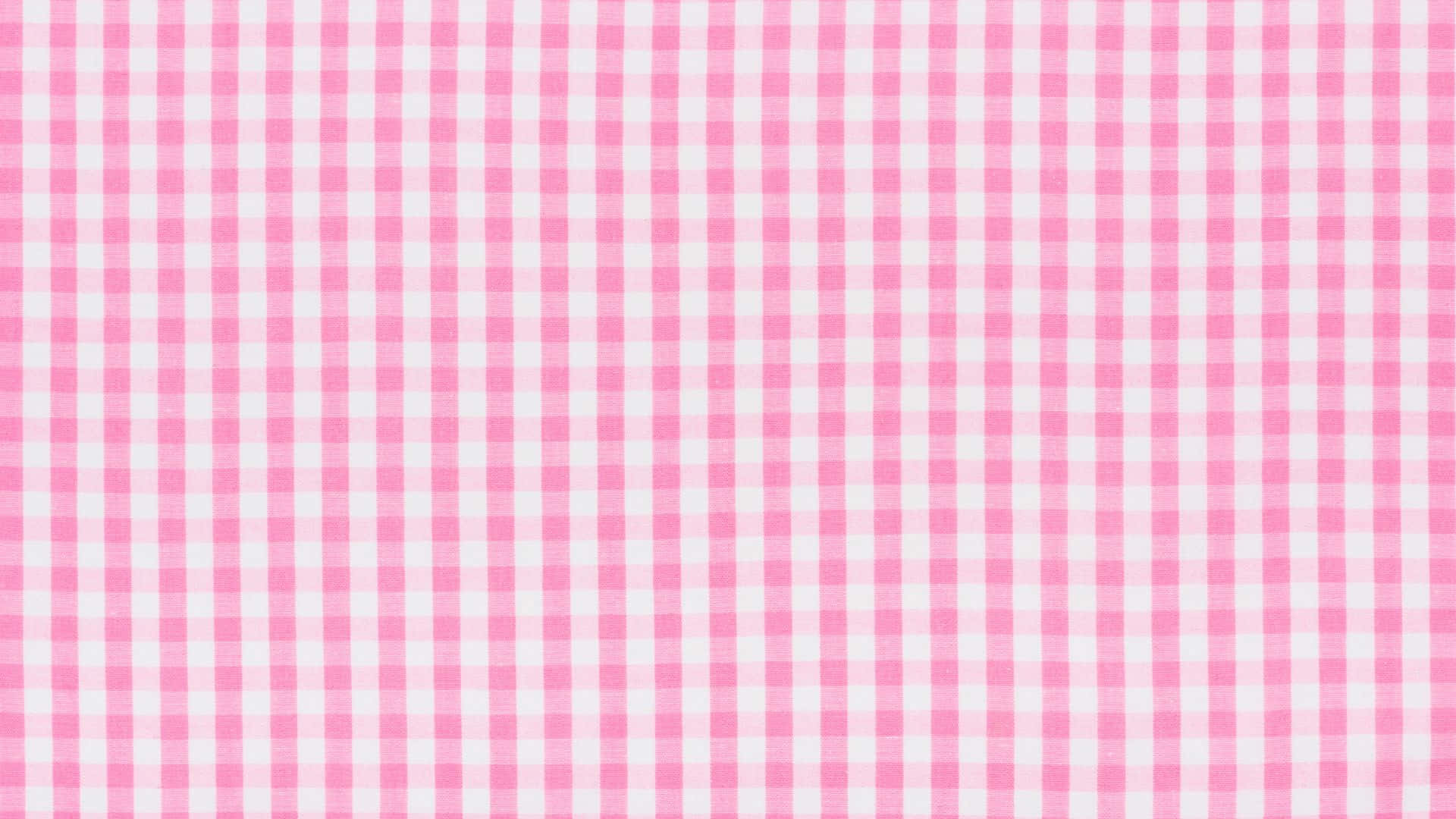 Pink Checkered 桌布 壁紙 — 粉紅與白色格紋布料的近距離特寫，帶有細膩的編織紋理。