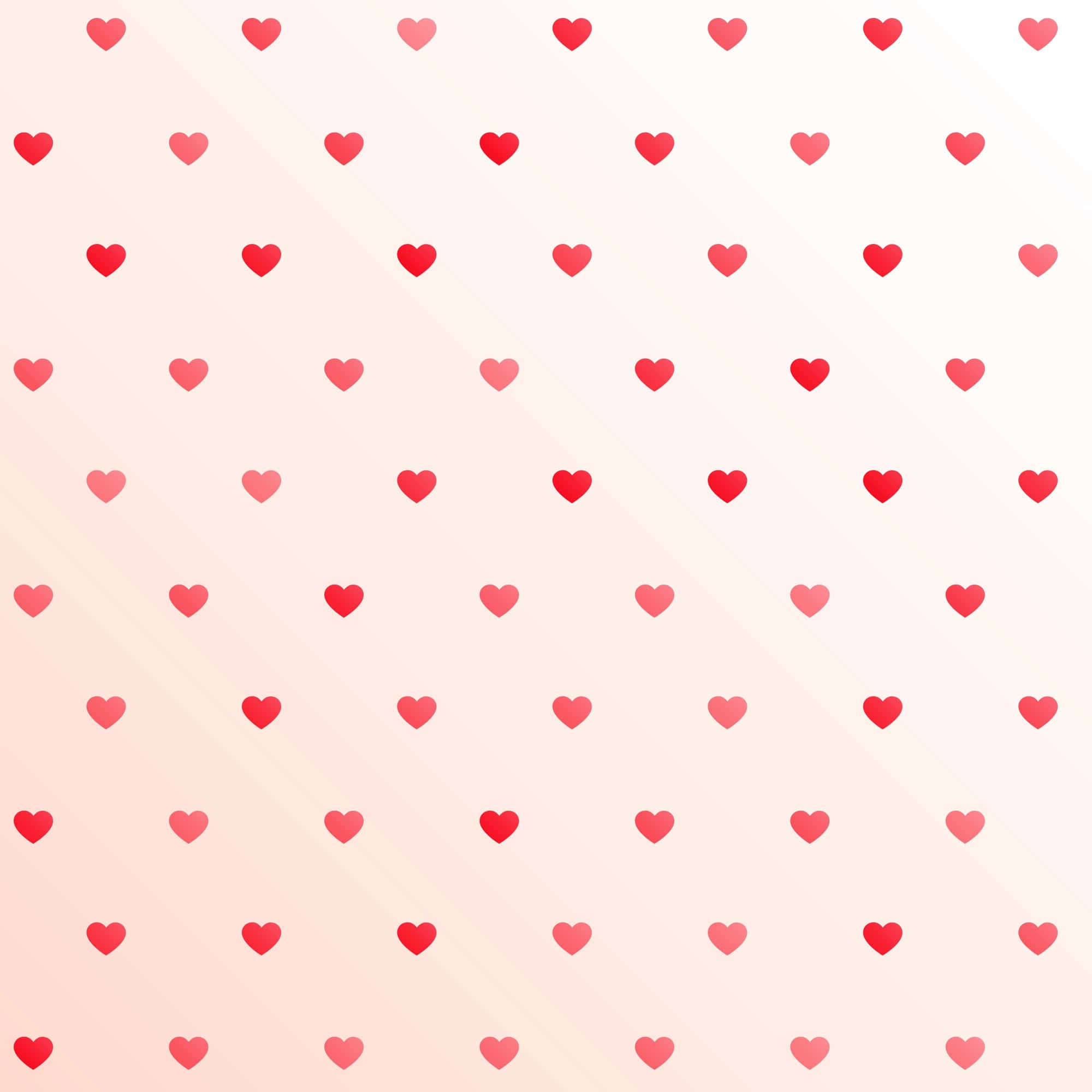 Heart Pattern 桌布 壁紙 — 粉紅與白色的柔和漸層背景，點綴著散落的紅色和粉紅色愛心重複圖案。