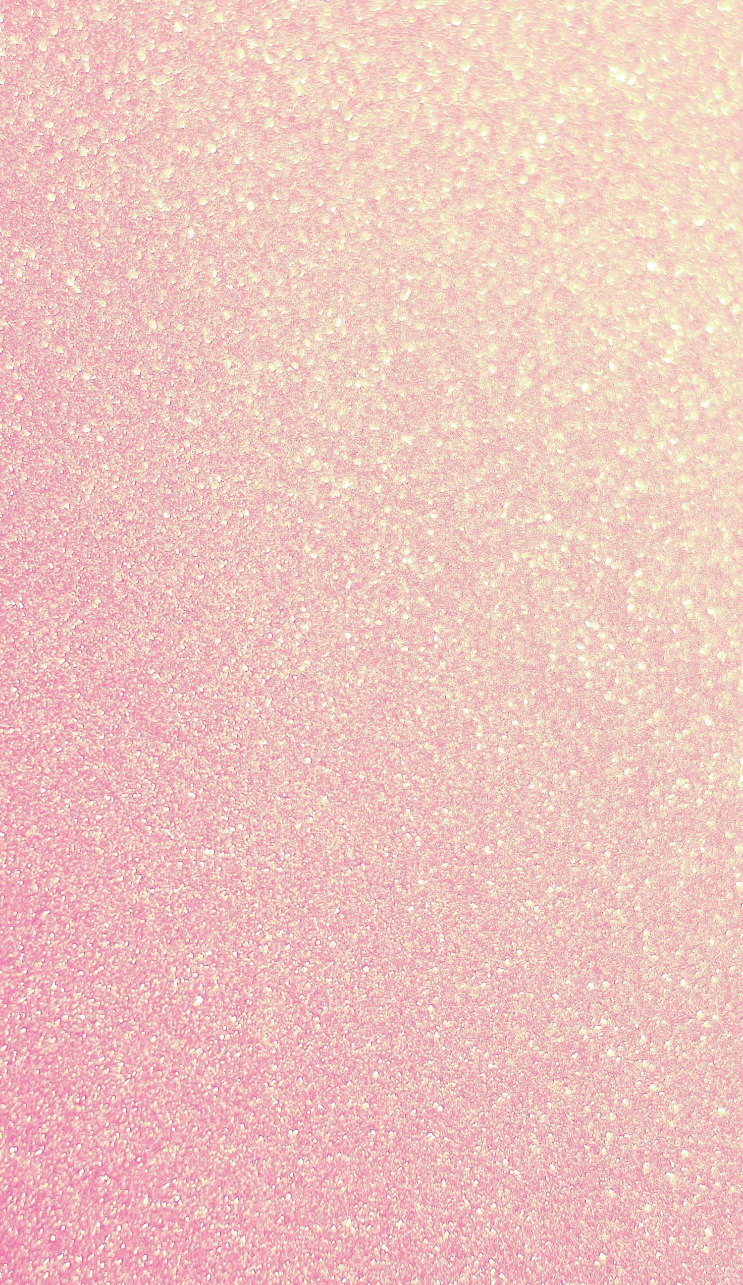 Sparkle Aesthetic 桌布 壁紙 — 粉紅色和奶油色的柔和漸層閃粉在整個框架中閃爍，營造出夢幻般的閃爍質感。