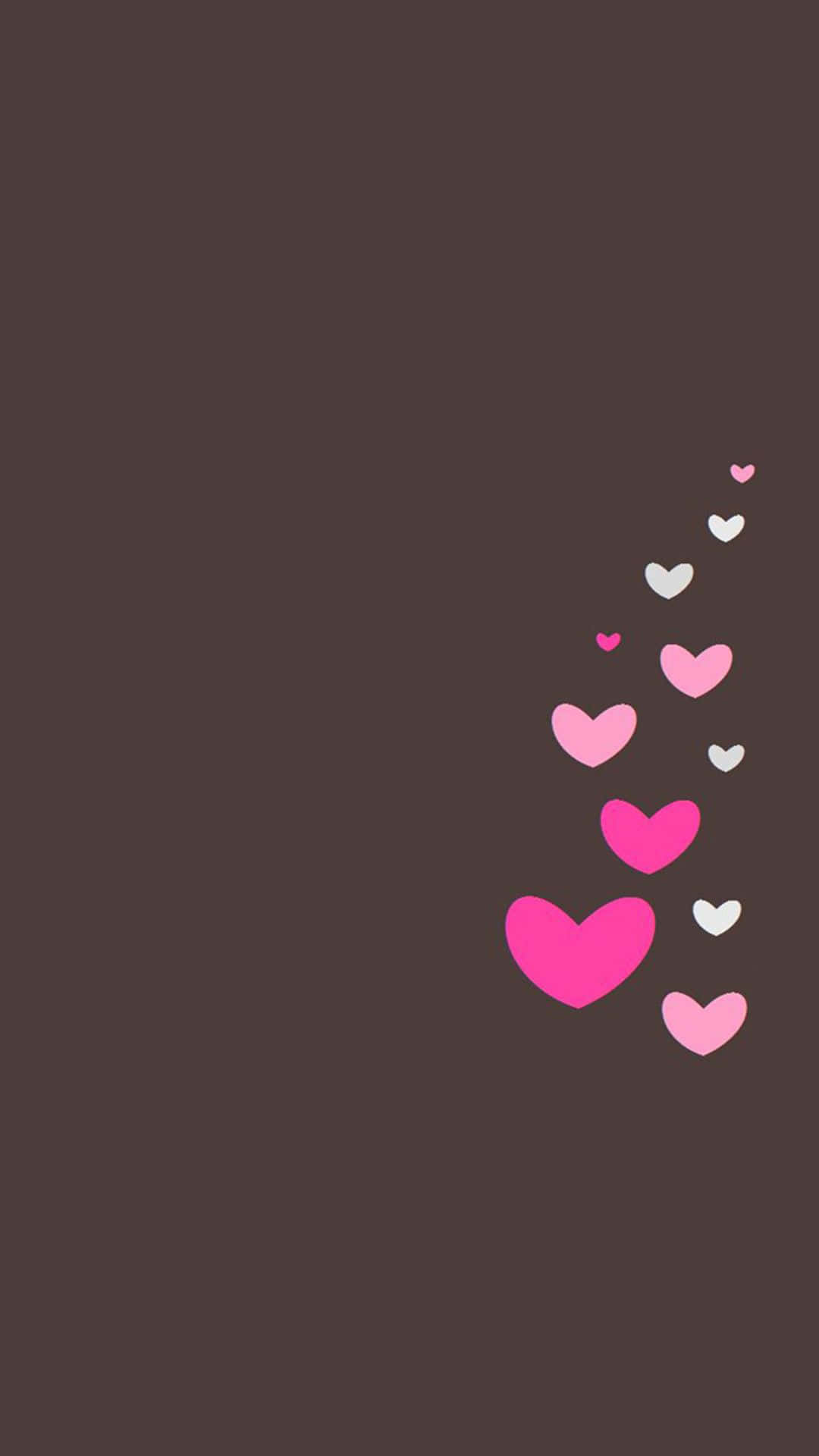 Valentines 桌布 壁紙 — 粉紅色和白色的心形瀑布對角漂浮在純棕色背景上。