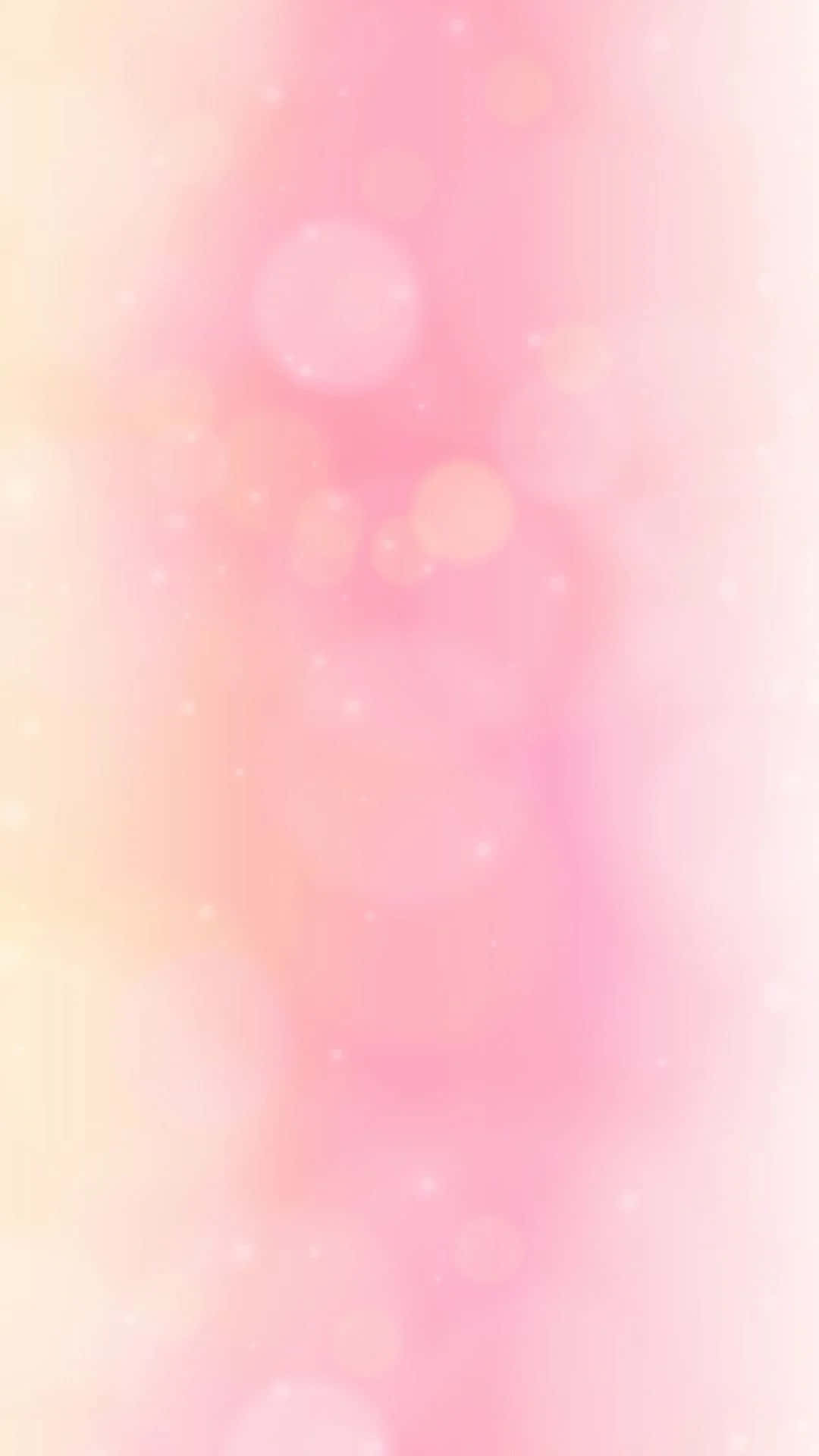 Pink Phone 桌布 壁紙 — 粉紅色和黃色的柔和漸變，帶有發光散景圓圈和閃爍粒子，營造出夢幻空靈的背景。