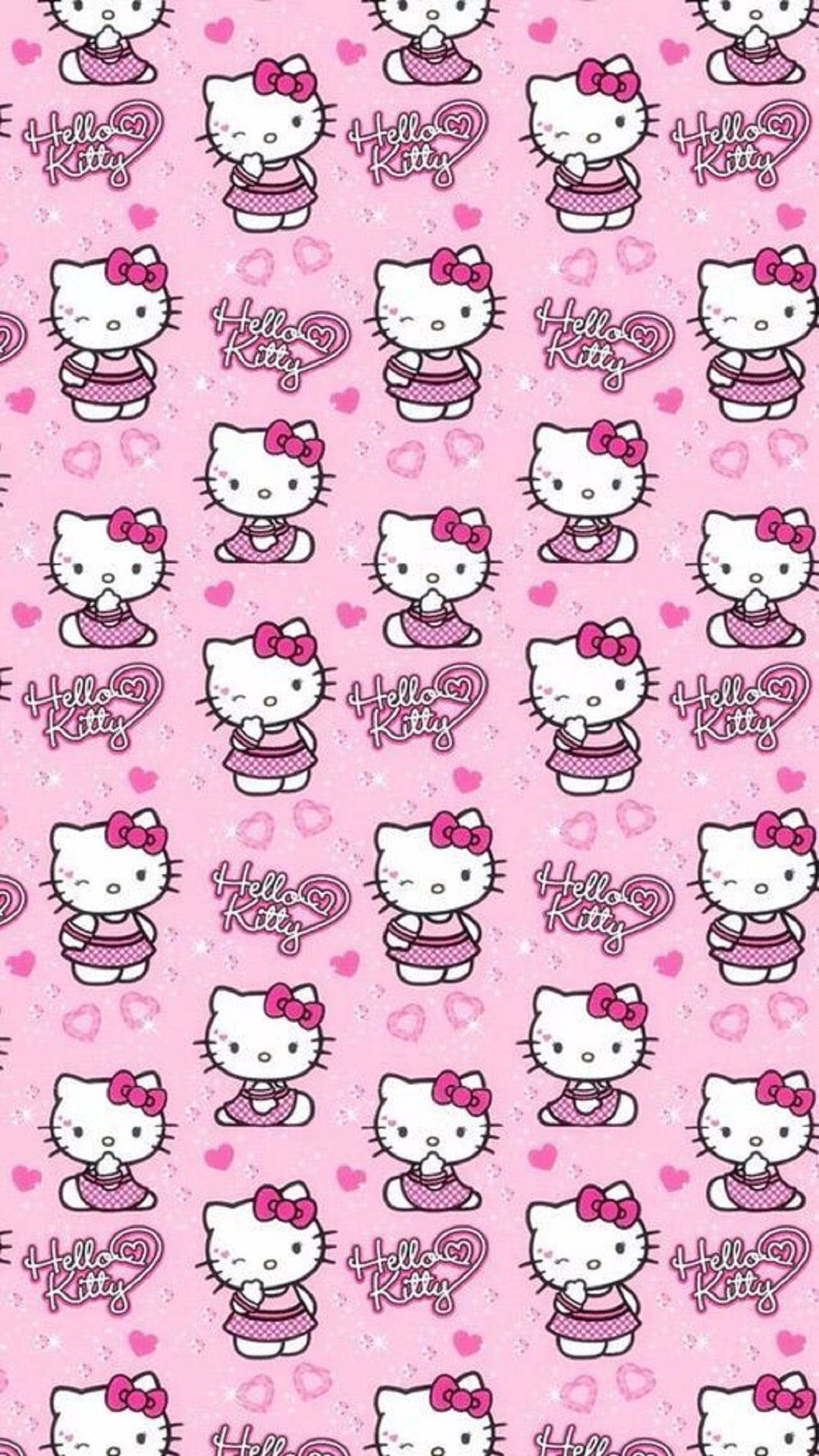 Hello Kitty 桌布 壁紙 — 粉紅色壁紙圖案，重複出現穿著波點裙、帶有心形和亮粉裝飾的Hello Kitty角色。