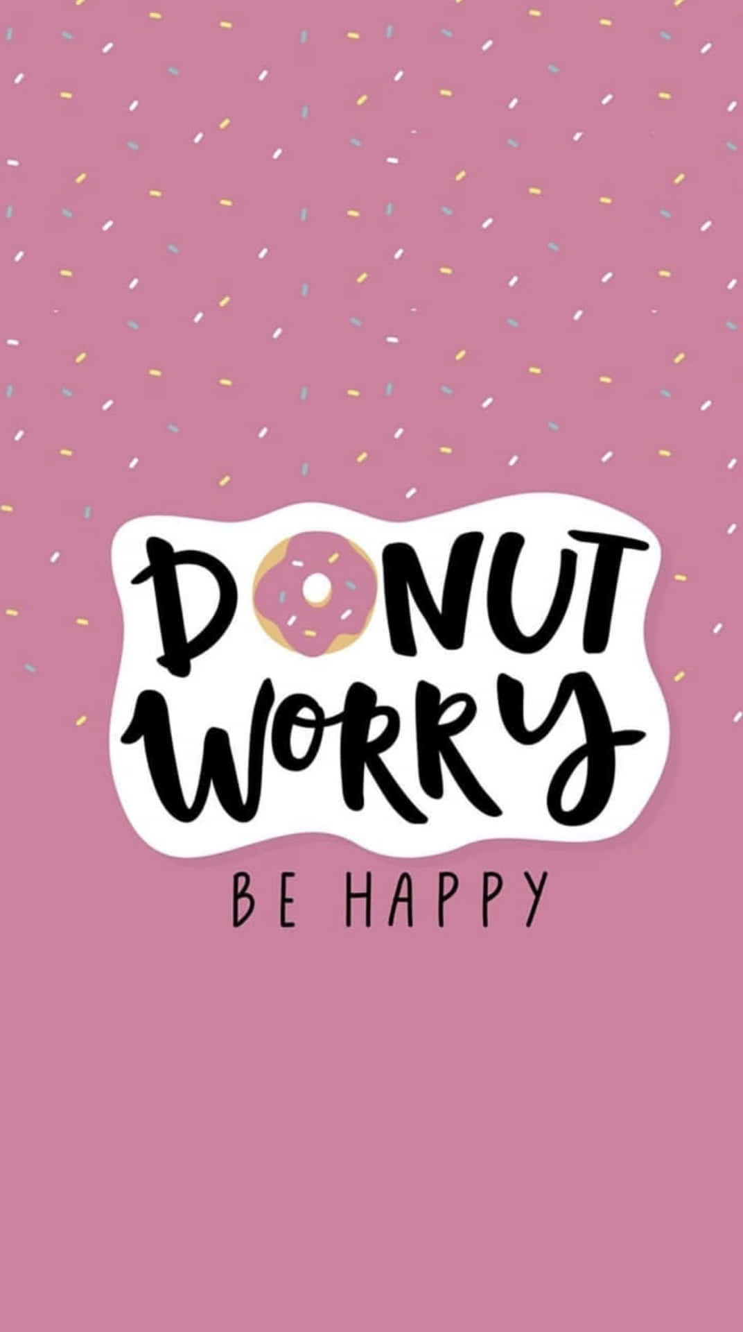 Happy iPhone 桌布 壁紙 — 粉紅色背景，配有彩色紙屑和一個有趣的「DONUT WORRY BE HAPPY」文字，其中甜甜圈取代了字母O。