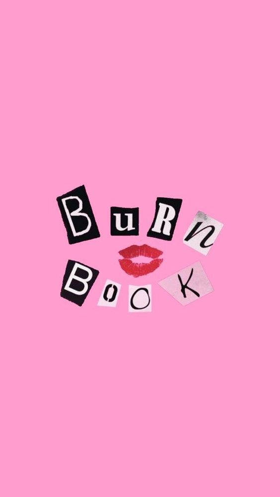 Pink Vintage Aesthetic 桌布 壁紙 — 粉紅色背景上散落著黑色和白色的字母瓷磚，拼出 'BURN BOOK' 和一個紅色唇膏吻痕。