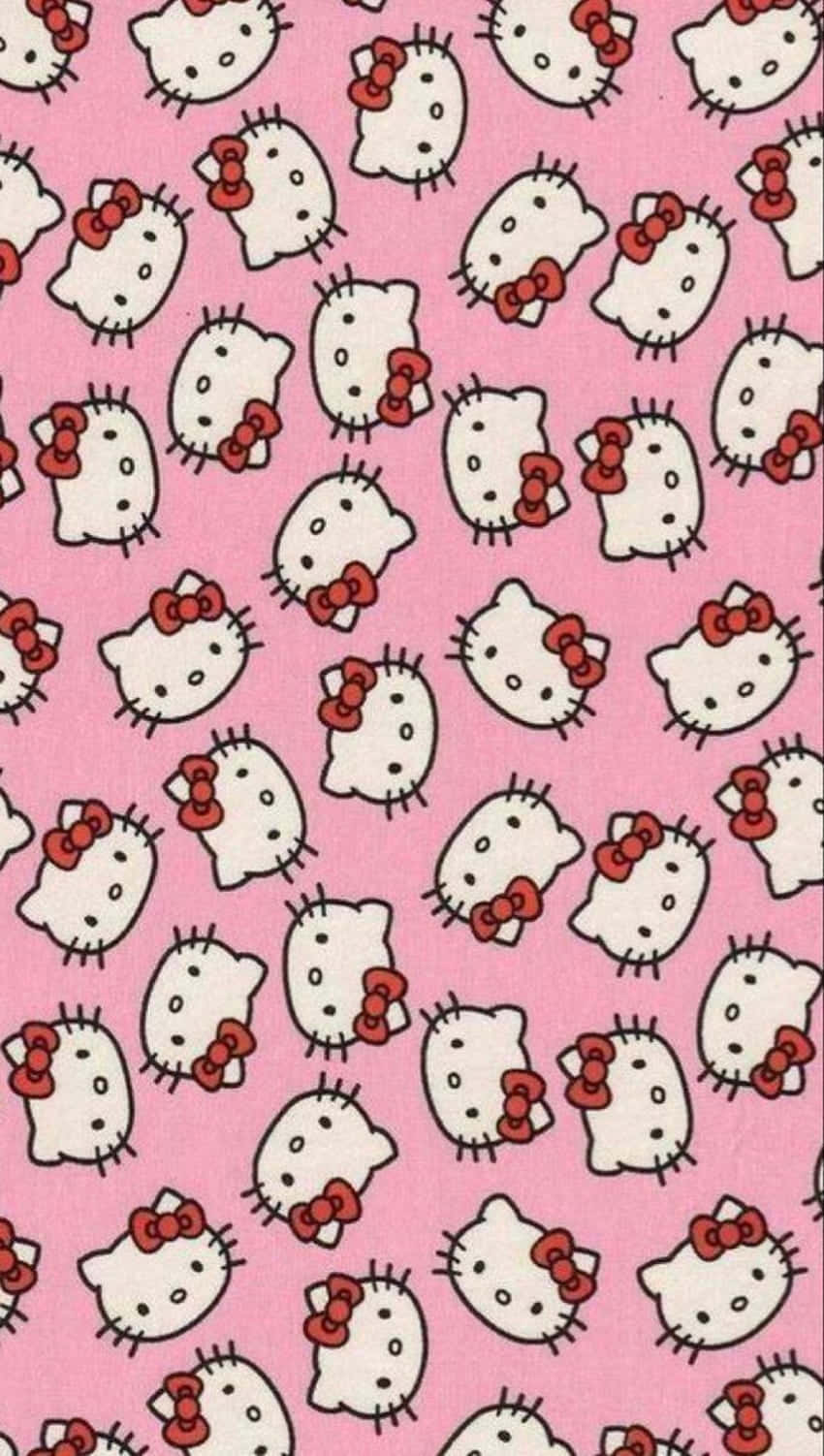Emo Hello Kitty 桌布 壁紙 — 粉紅色背景上重複覆蓋著戴紅色蝴蝶結的白色Hello Kitty面孔。