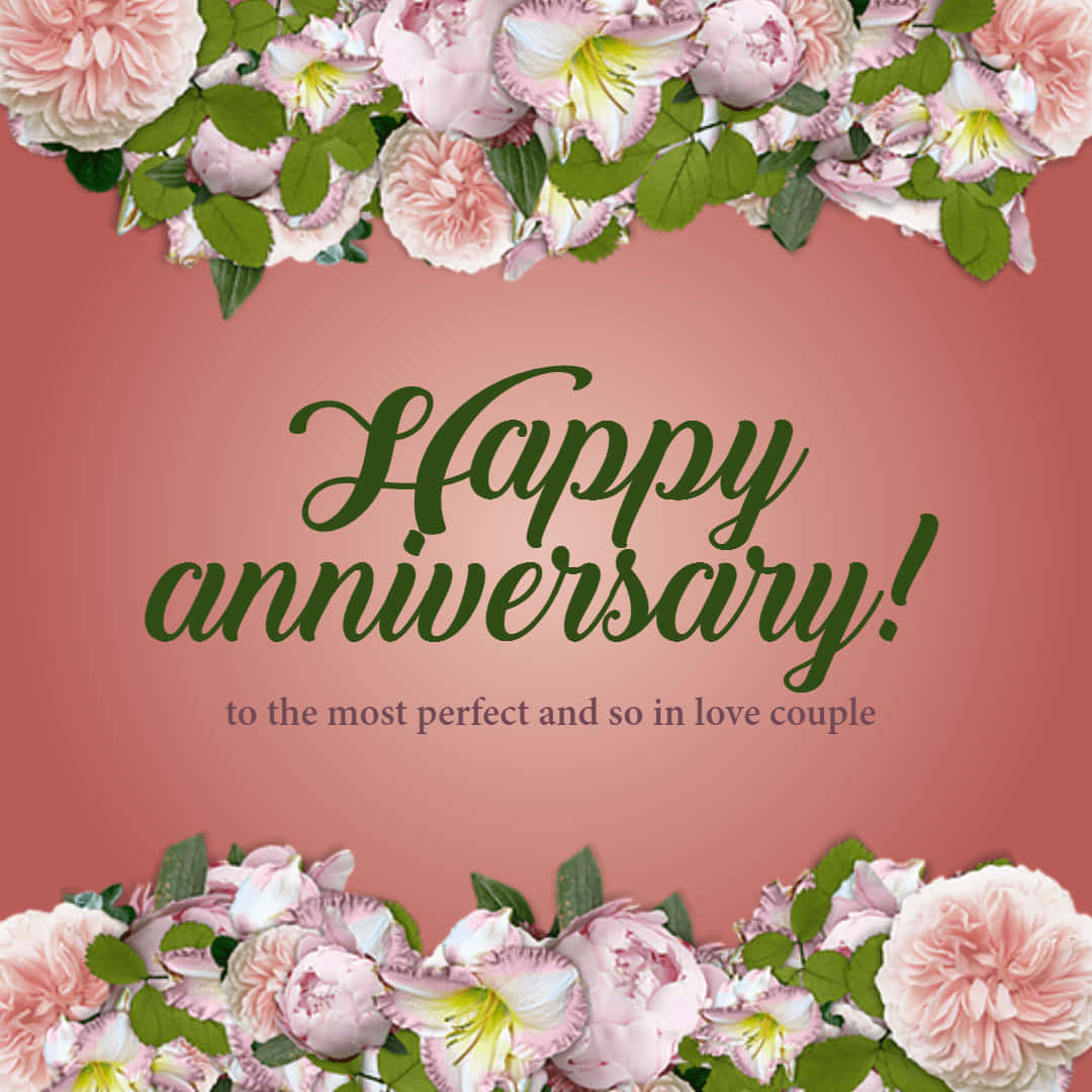 Anniversary 桌布 壁紙 — 粉紅色花卉邊框圍繞著優雅的綠色字體 'Happy anniversary!'，背景為柔和珊瑚色。
