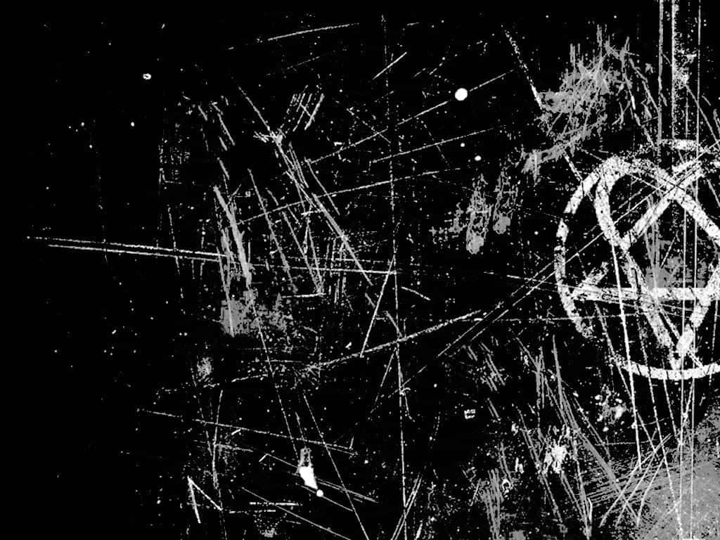 Dark Grunge 桌布 壁紙 — 粗糙的黑白抽象構圖，帶有混亂的刮痕和五角星符號。