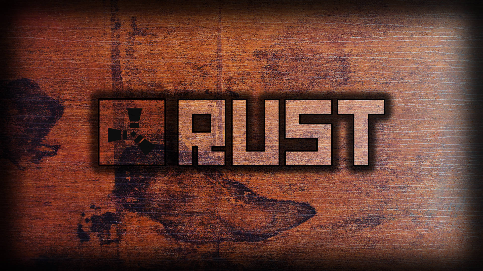 標誌 桌布 壁紙 — 粗體大字「RUST」連同放射性標誌，放置在帶有深色污漬和暗角效果的風化木質表面上。