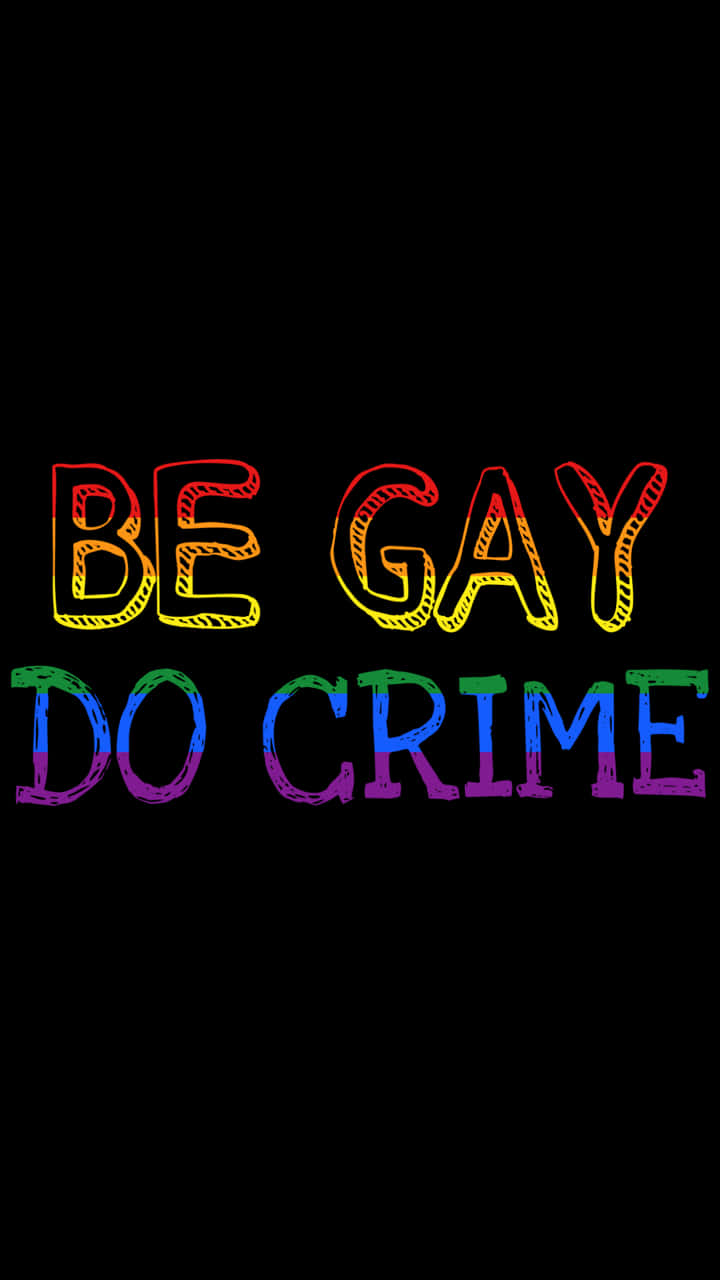 Im Gay 桌布 壁紙 — 粗體彩虹色文字在純黑色背景上以草圖輪廓效果顯示「BE GAY DO CRIME」。