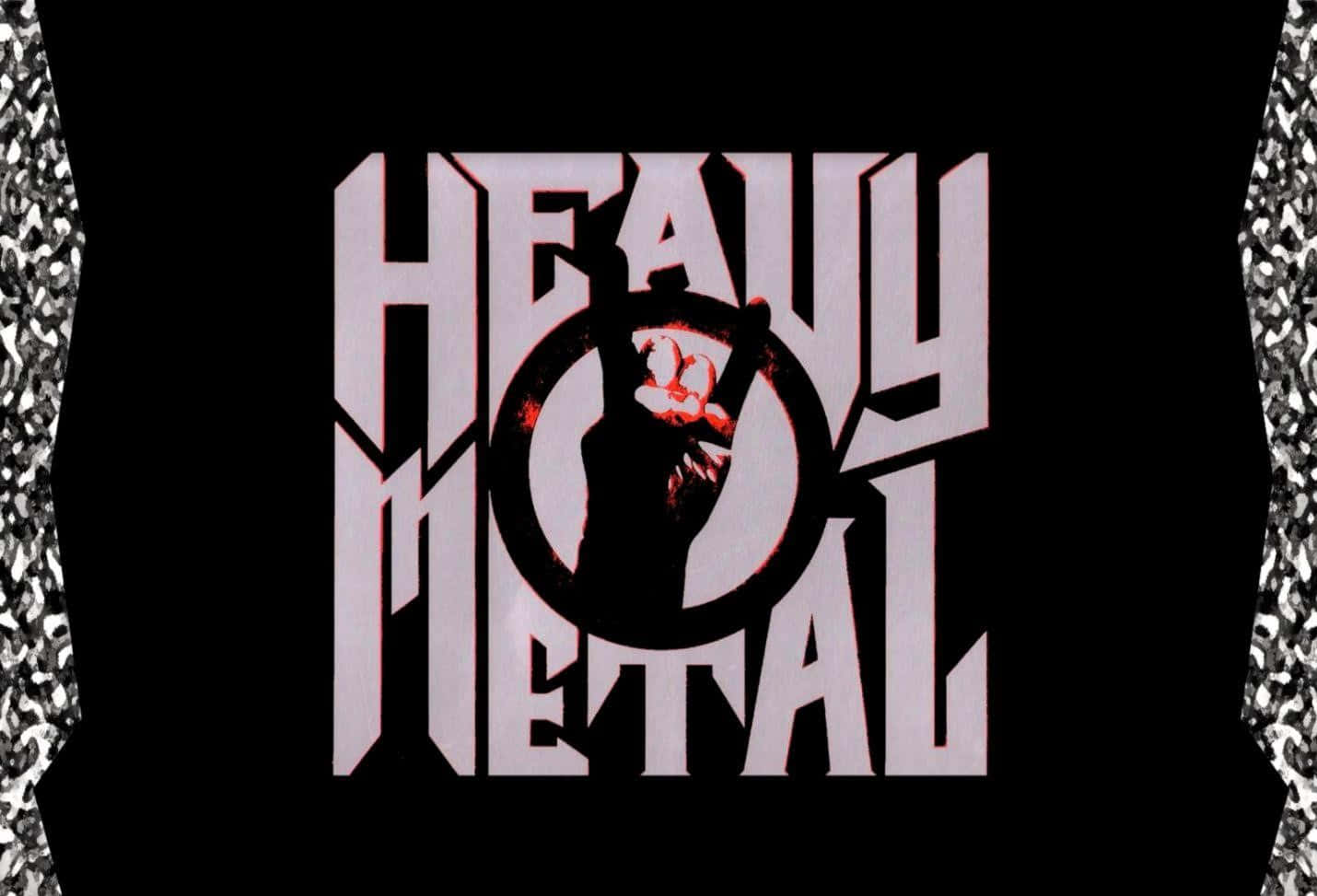 Heavy Metal 桌布 壁紙 — 粗體白色 'HEAVY METAL' 文字，中央有舉起的拳頭圖案，背景為黑色，兩側帶有銀色紋理。