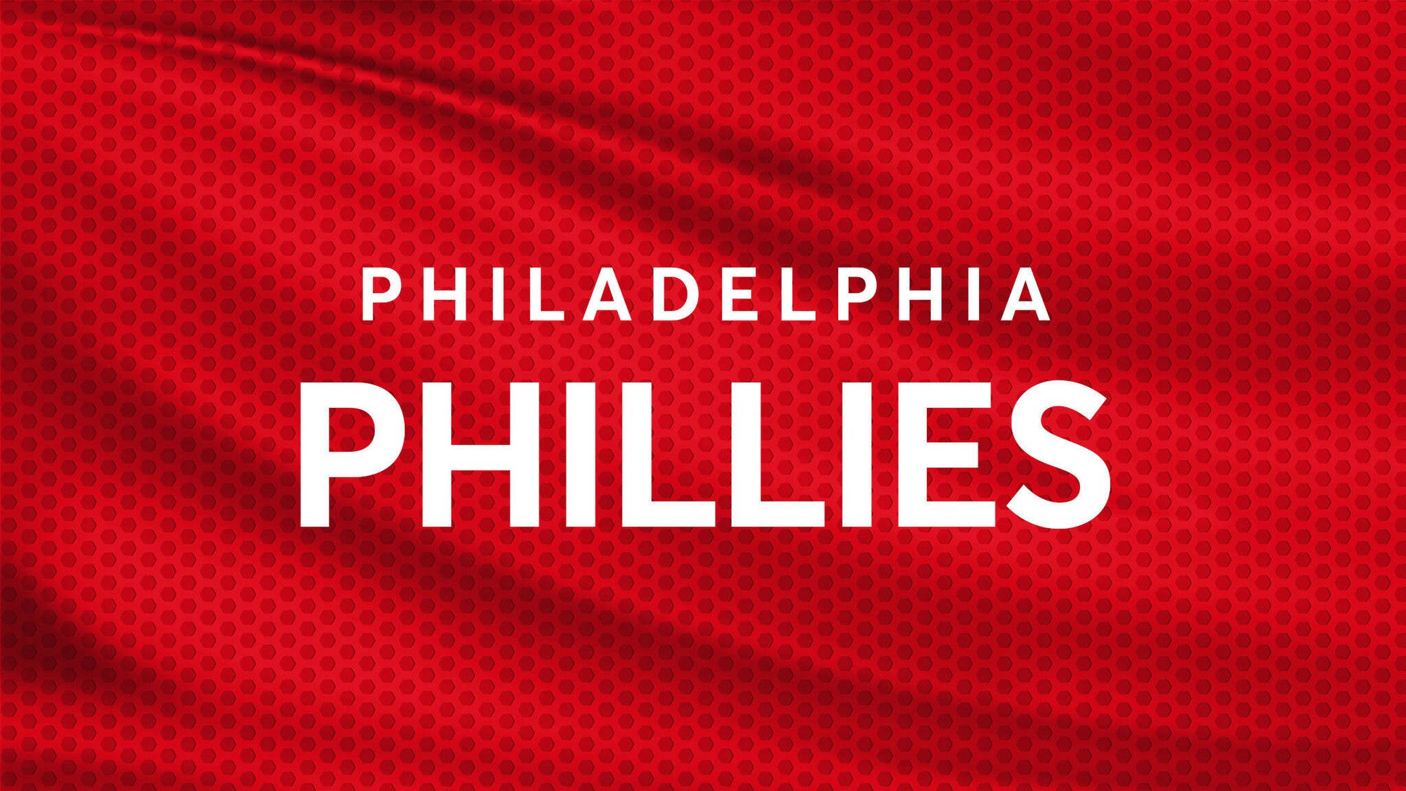 Phillies 桌布 壁紙 — 粗體白色 'PHILADELPHIA PHILLIES' 文字在帶有細微皺褶的紋理紅色布料背景上顯得格外突出。