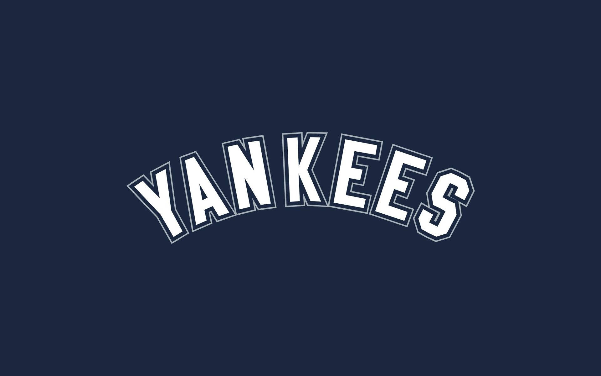 酷棒球 桌布 壁紙 — 粗體白色拱形 'YANKEES' 文字在純海軍藍色背景上突出顯示。