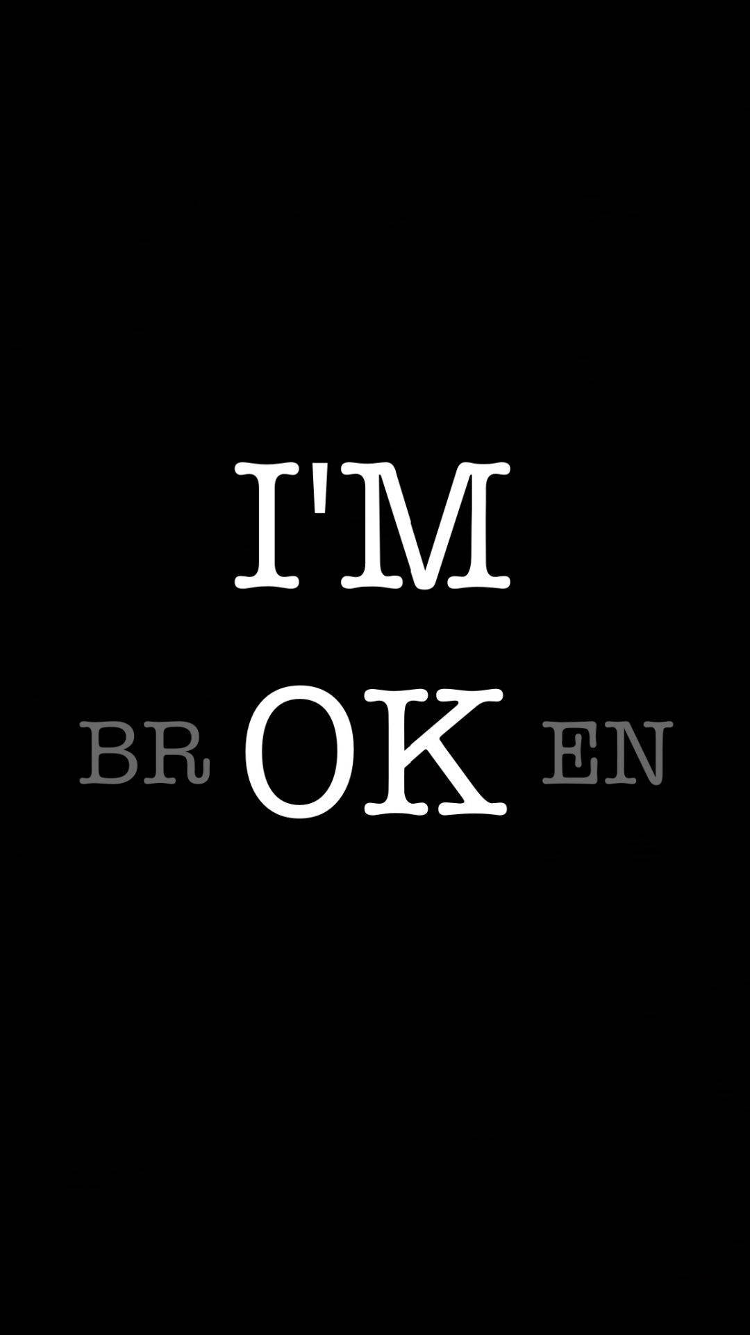 黑白 桌布 壁紙 — 粗體白色文字「I'M OK」居中顯示在純黑色背景上，灰色字母「BR」和「EN」分別位於「OK」兩側。