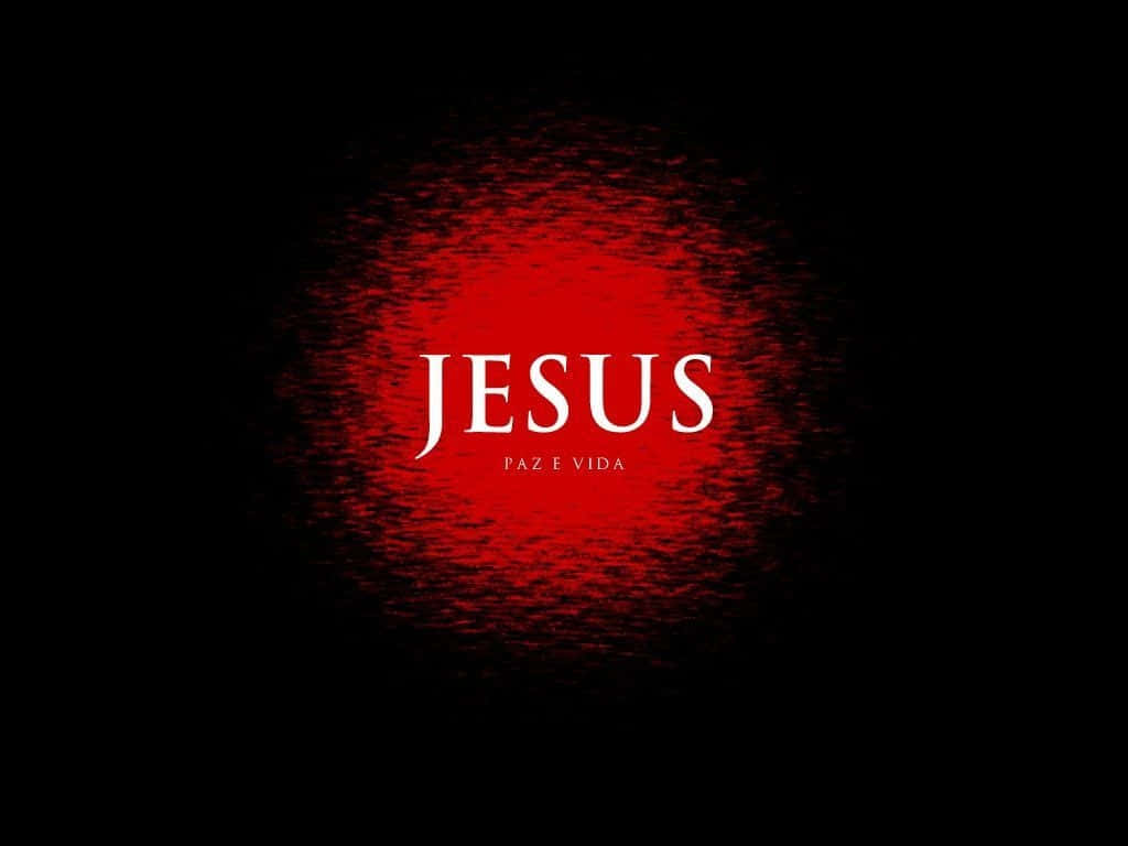 Jesus Name 桌布 壁紙 — 粗體白色文字「JESUS」和「PAZ E VIDA」居中於發光紅色紋理圓圈上，背景為黑色。