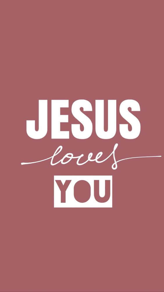 God Loves You 桌布 壁紙 — 粗體白色文字在純色塵粉玫瑰背景上寫著「JESUS loves YOU」。