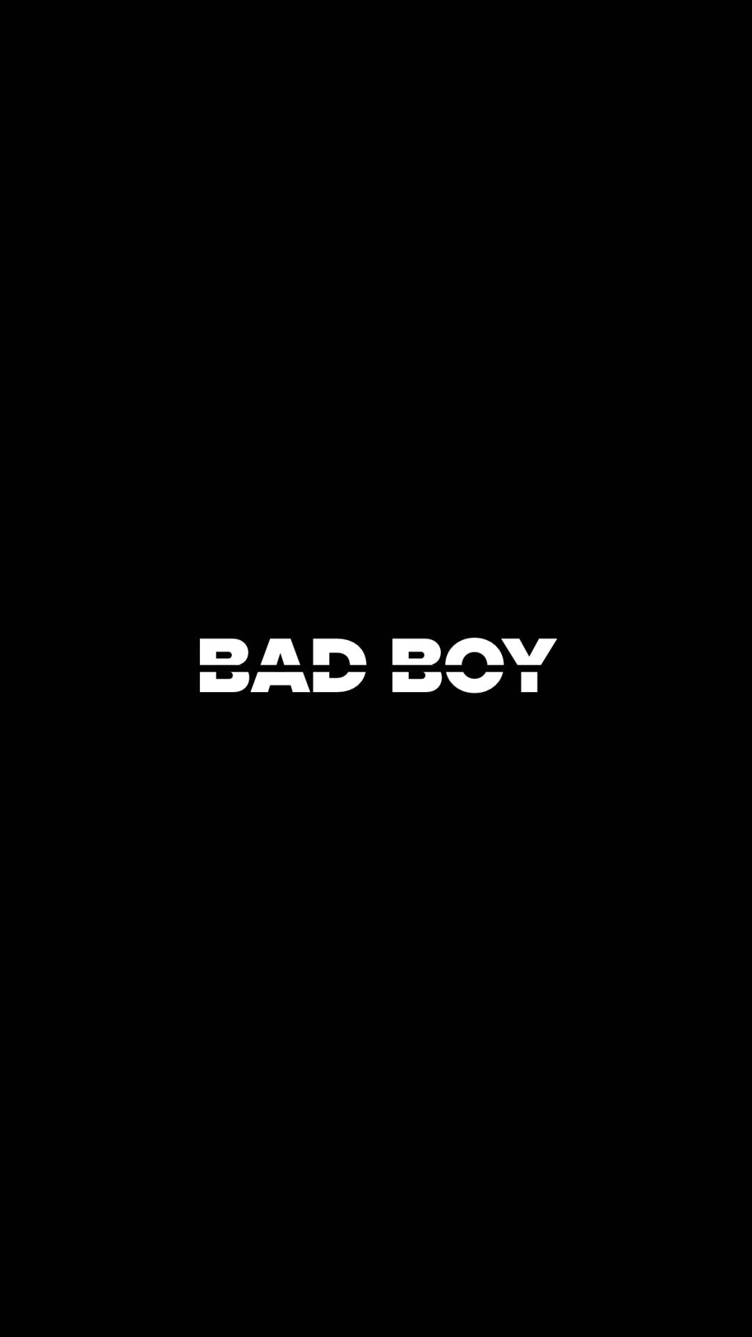 bad 桌布 壁紙 — 粗體白色文字寫著 bad boy，居中於純黑色背景上。