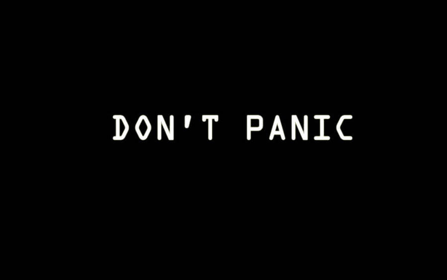 Panic 桌布 壁紙 — 粗體白色文字寫著「DON'T PANIC」，居中顯示在純黑色背景上。