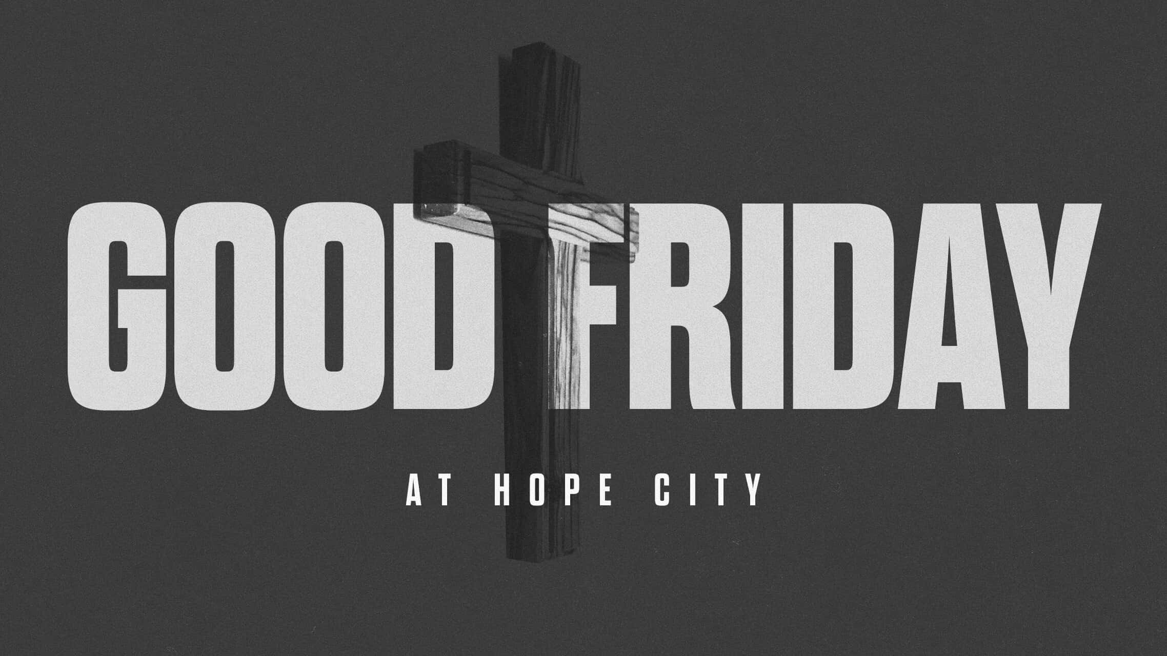 Good Friday 桌布 壁紙 — 粗體白色文字寫著「GOOD FRIDAY AT HOPE CITY」，背後中央有一個木製十字架，背景為深灰色。