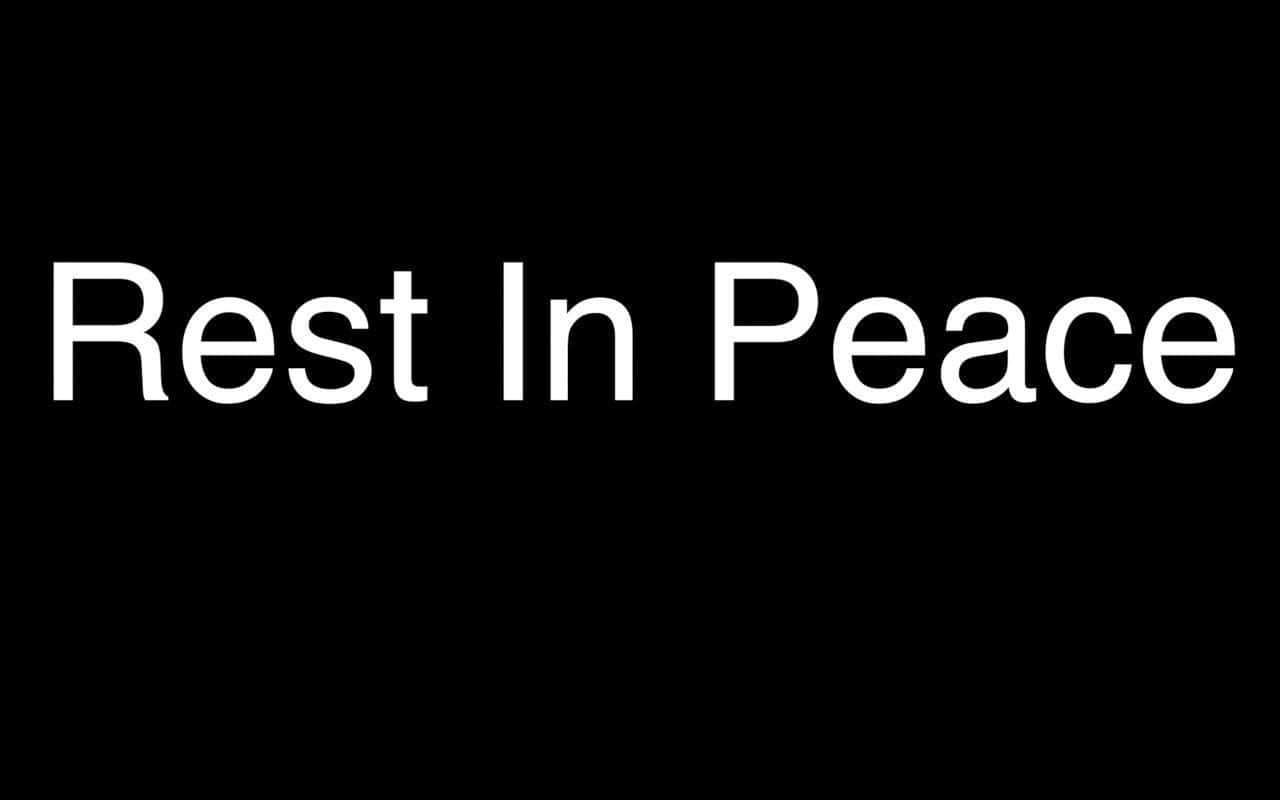 Rip 桌布 壁紙 — 粗體白色文字寫著「Rest In Peace」，居中在純黑色背景上。