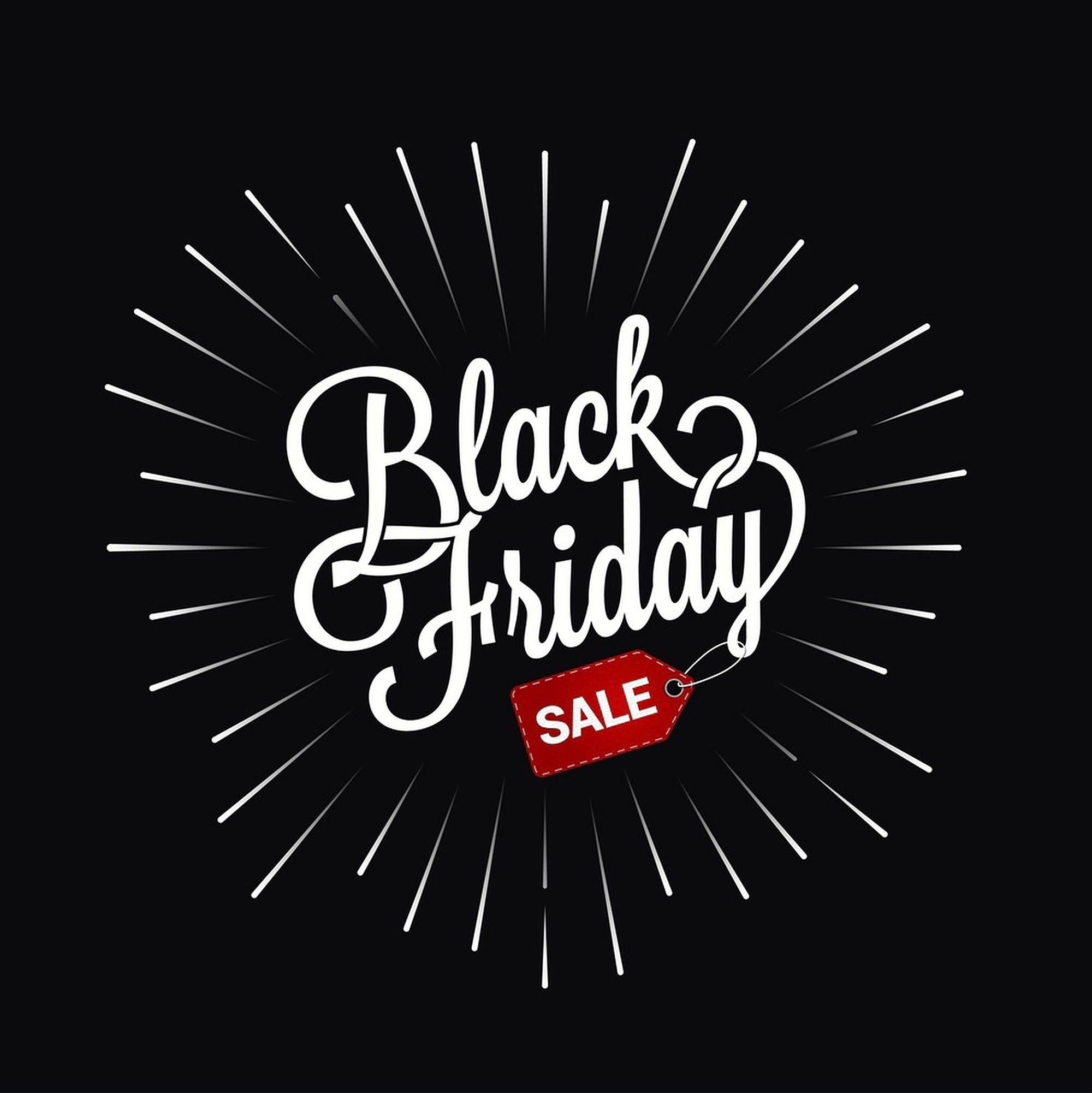 Friday 桌布 壁紙 — 粗體白色書法寫著 Black Friday，紅色促銷標籤在黑色背景上散發線條。