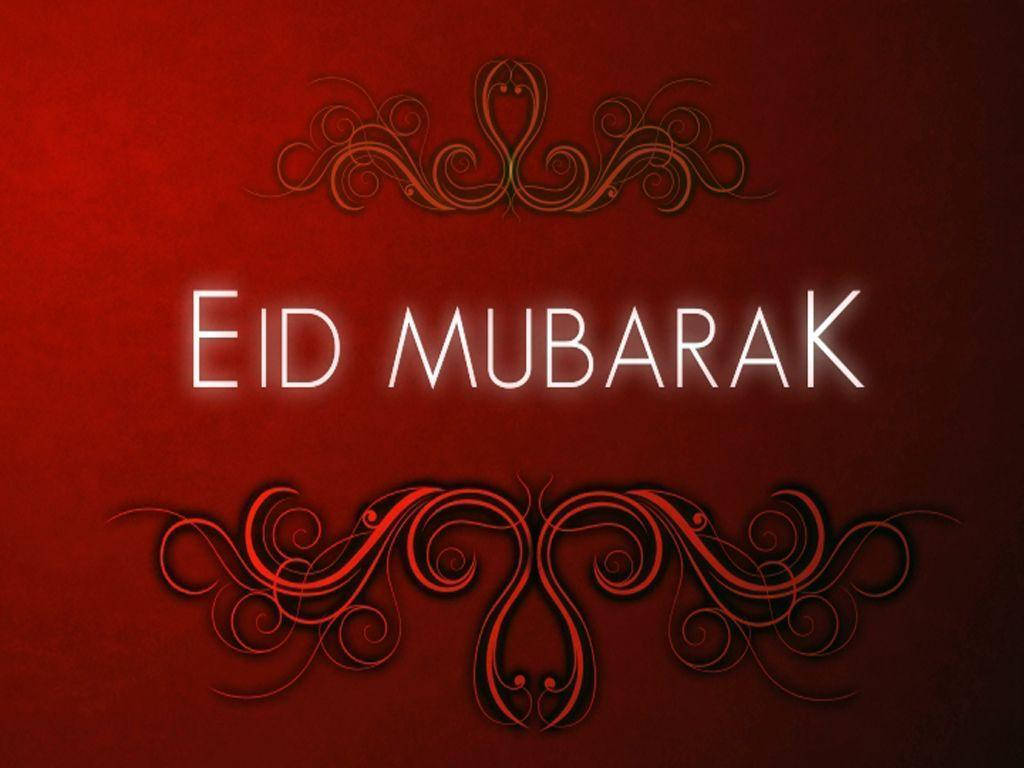 Eid Mubarak 桌布 壁紙 — 粗體白色發光文字 'EID MUBARAK' 居中於豐富的紅色紋理背景上，並以華麗的深色漩渦裝飾邊框。