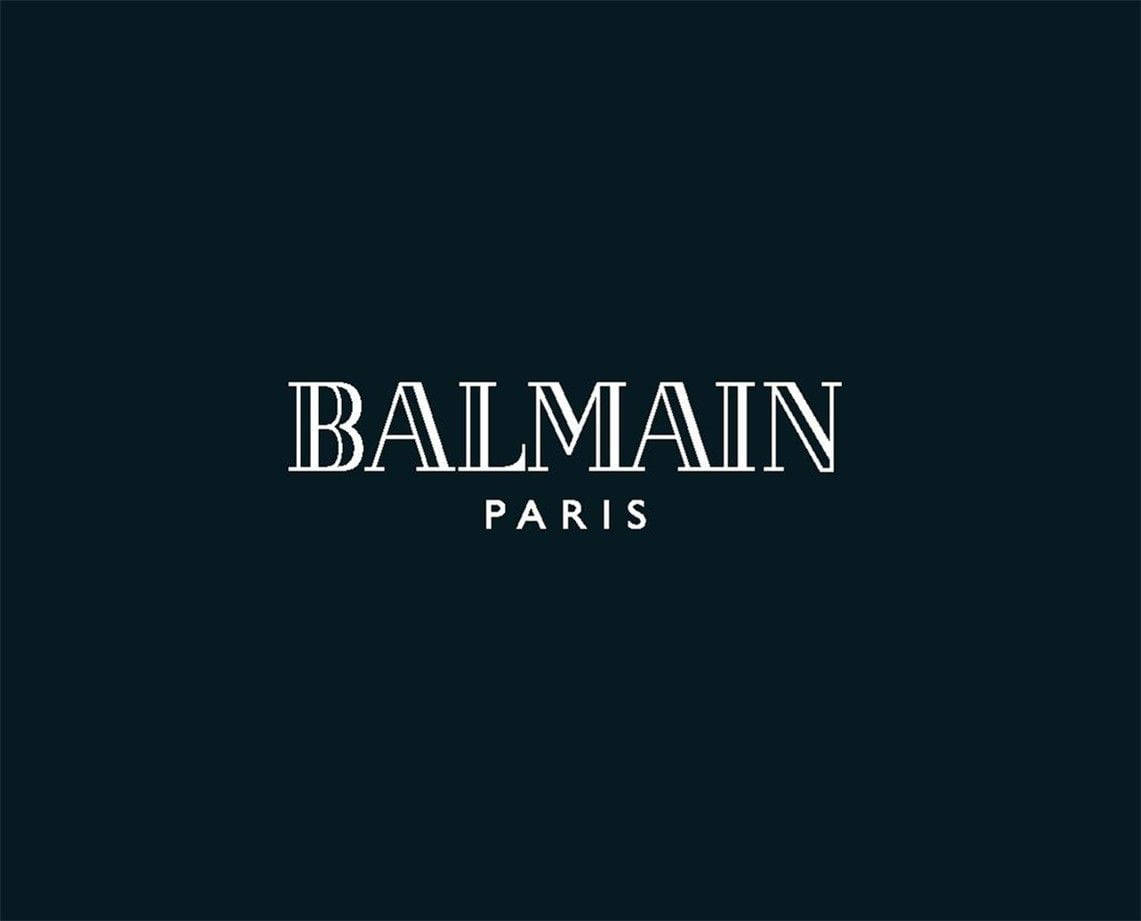桌布 壁紙 — 粗體白色襯線字體在純深海軍藍背景上拼寫出 BALMAIN PARIS。