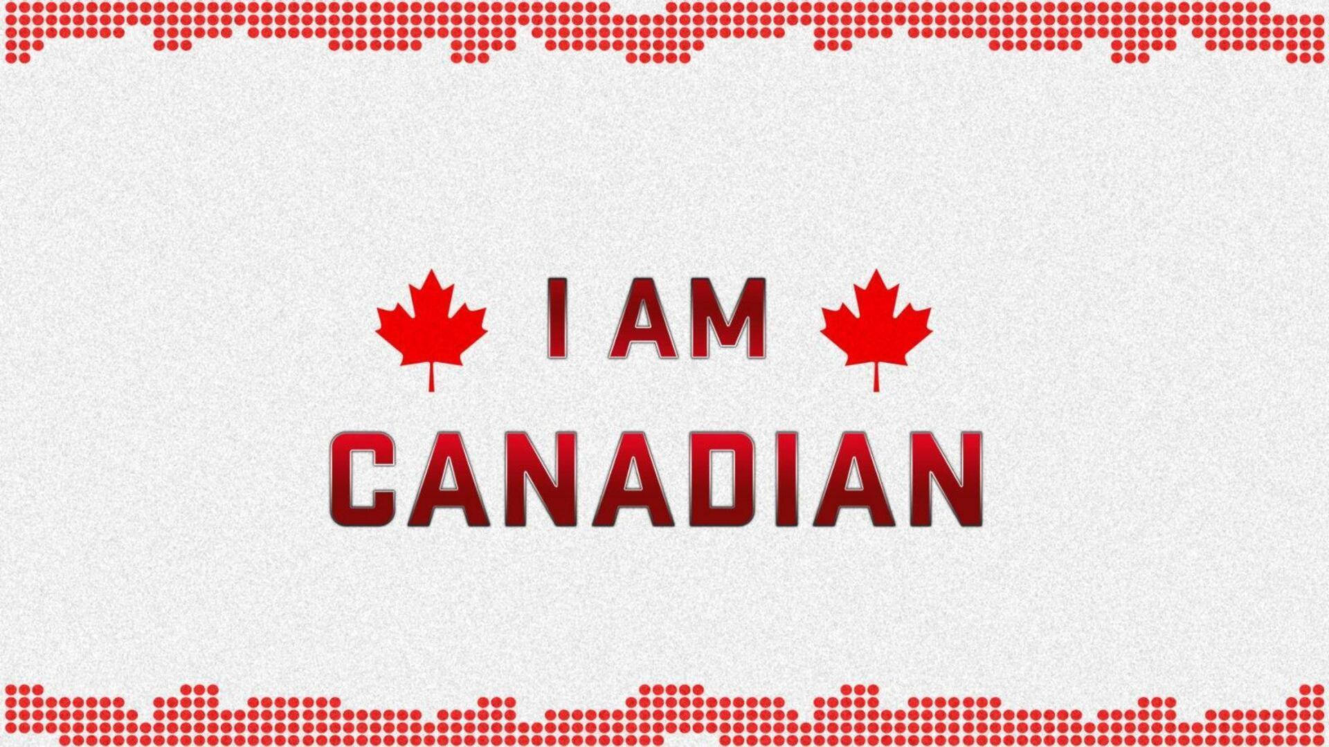 Canada Day 桌布 壁紙 — 粗體紅色文字宣示「I AM CANADIAN」，兩側有楓葉，背景為帶有紅色虛線邊框的紋理白色背景。